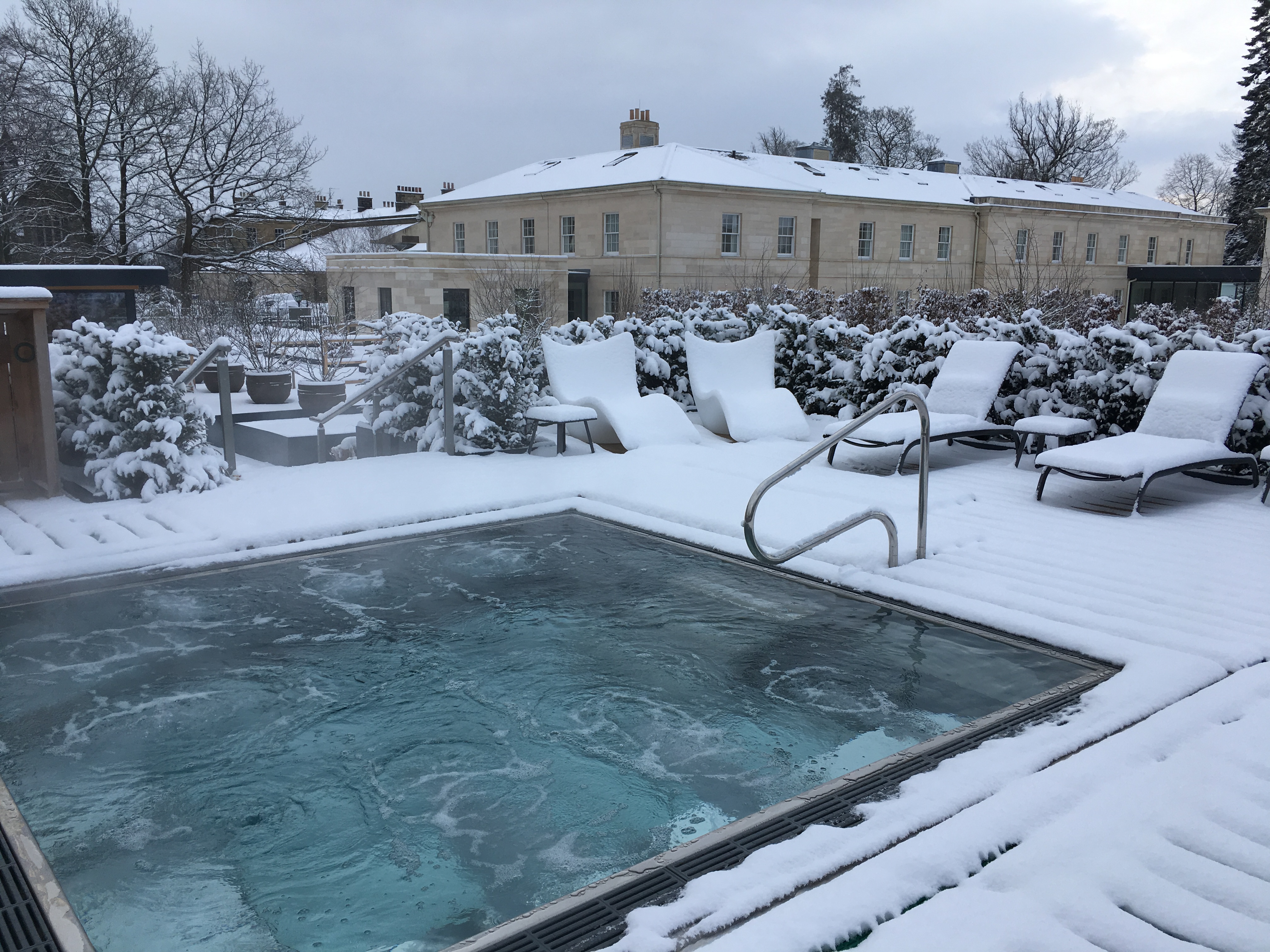Outdoor hot tub in snowy Rudding Park for corporate retreats and wellness events.