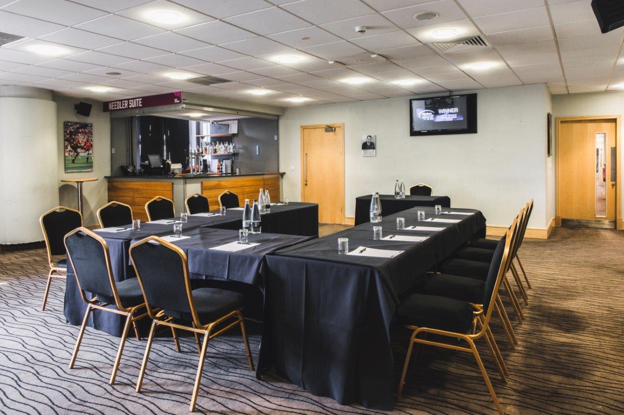 The Needler Suite in MKM Stadium, modern meeting room setup for professional events.