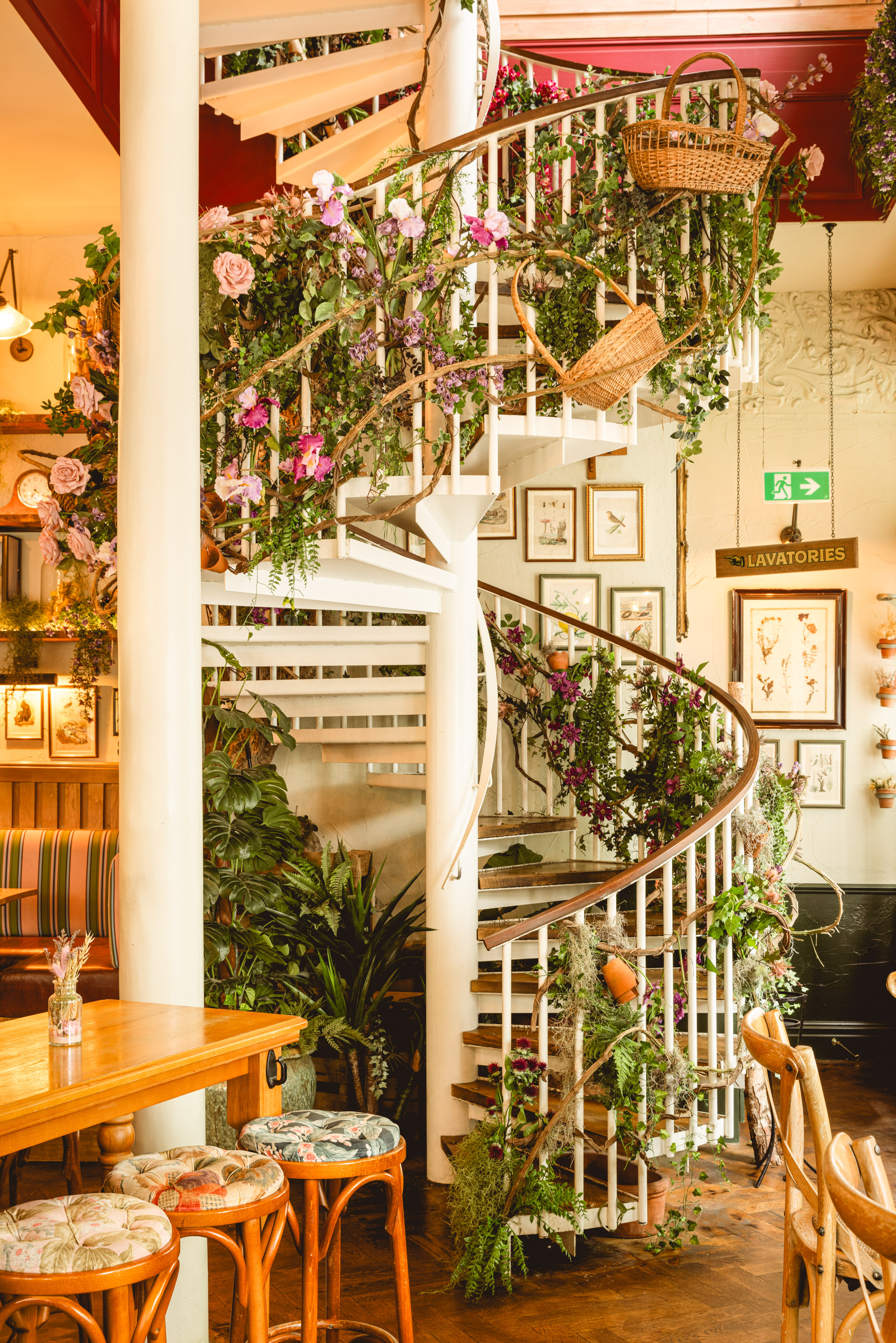 Spiral staircase with greenery in Mr Fogg's House of Botanicals for events and gatherings.