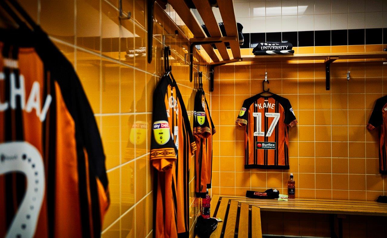 Vibrant MKM Stadium locker room, ideal for team-building events and workshops.