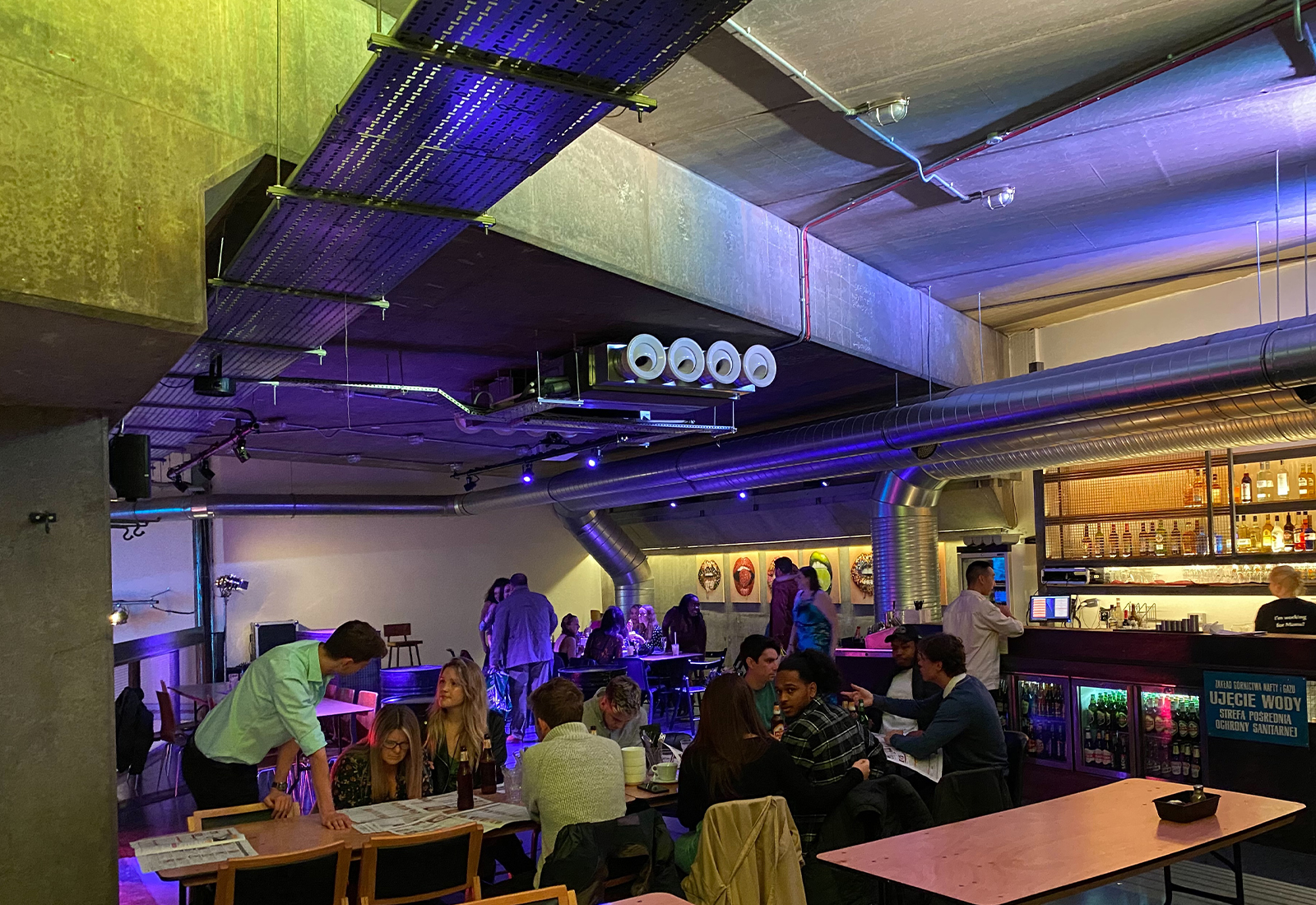 Modern event space with vibrant lighting for networking and social gatherings.