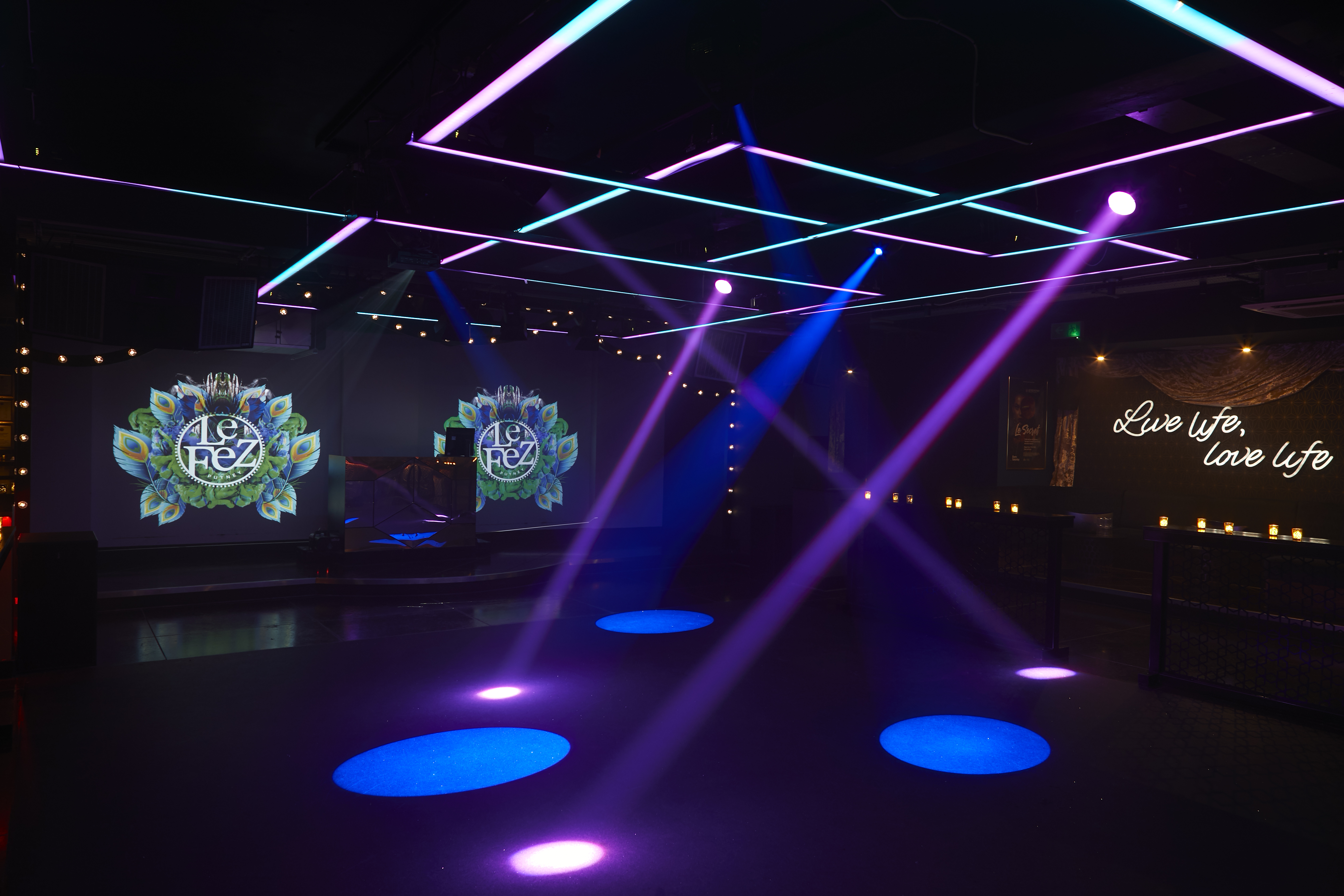 Vibrant event space in Le Fez with colorful lighting for parties and corporate events.