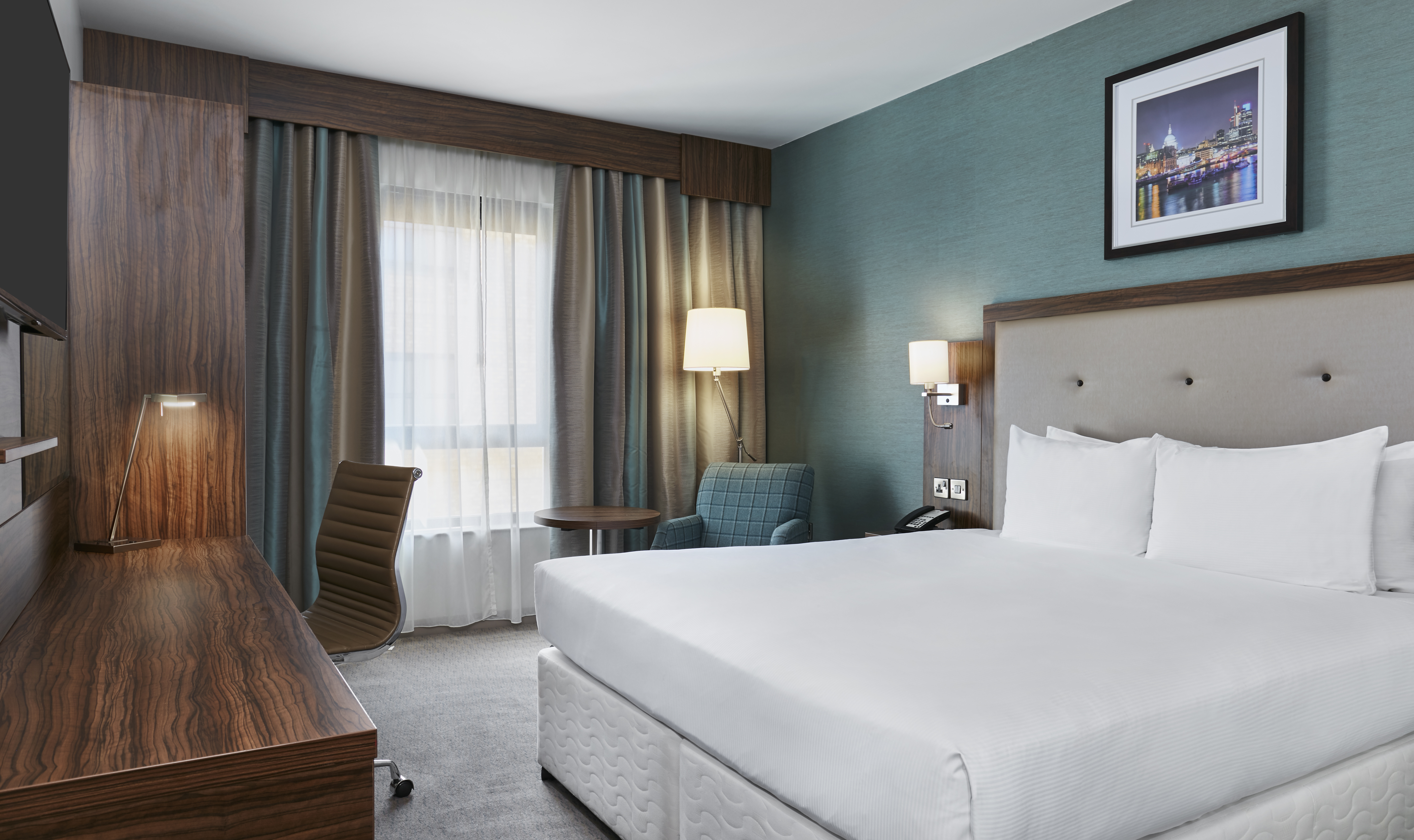 Modern hotel room at DoubleTree by Hilton, ideal for business travelers and events.
