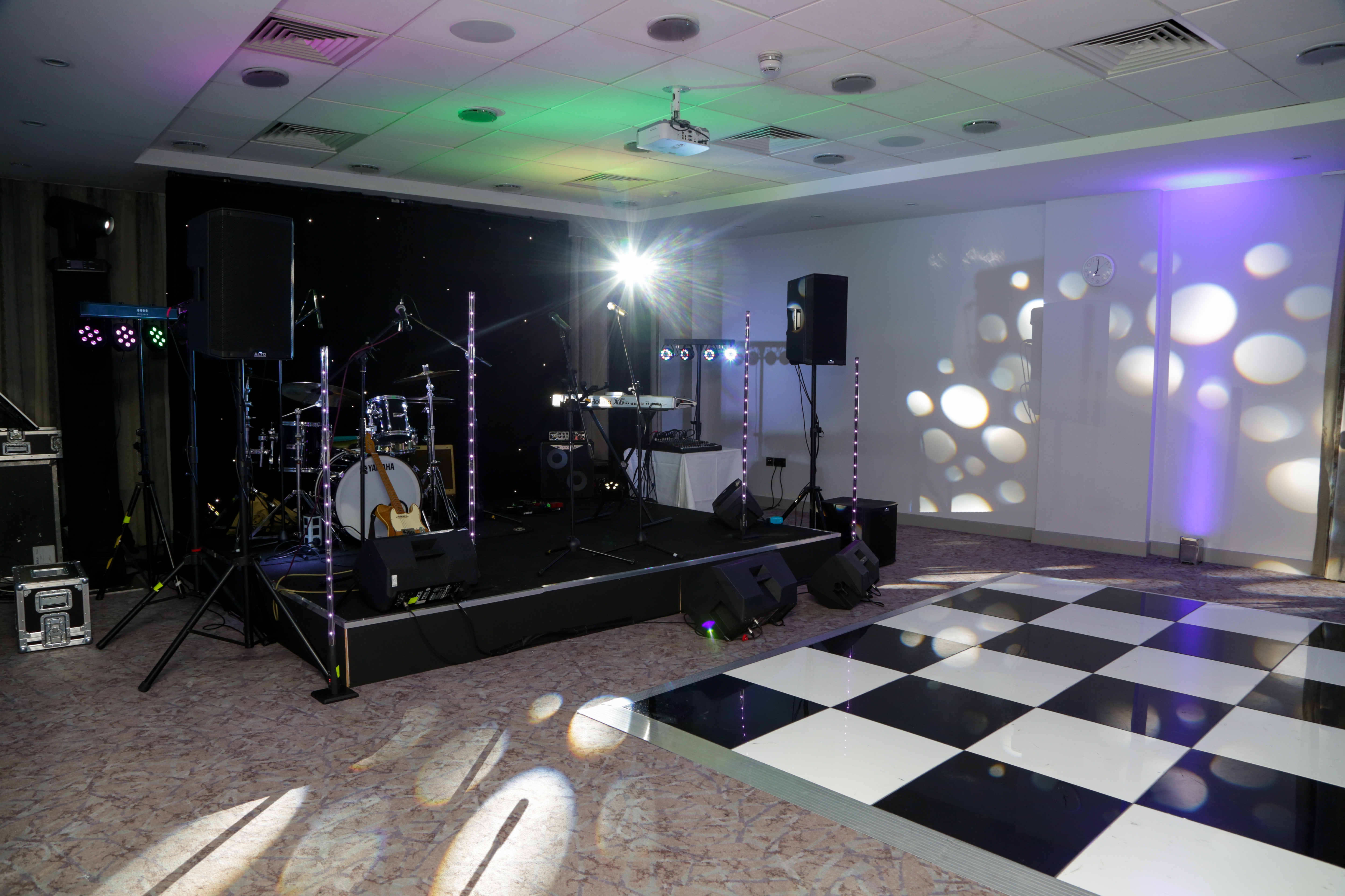 Kings Cross Suite at DoubleTree London, elegant event space with checkered dance floor.