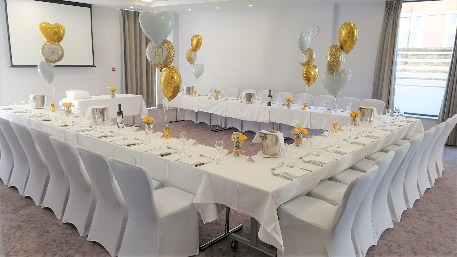 Kings Cross Suite event space with elegant tables, ideal for corporate gatherings and celebrations.