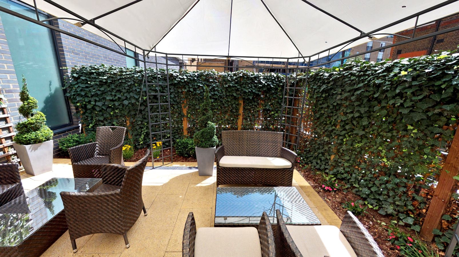Stylish outdoor lounge at DoubleTree by Hilton, ideal for networking events and meetings.