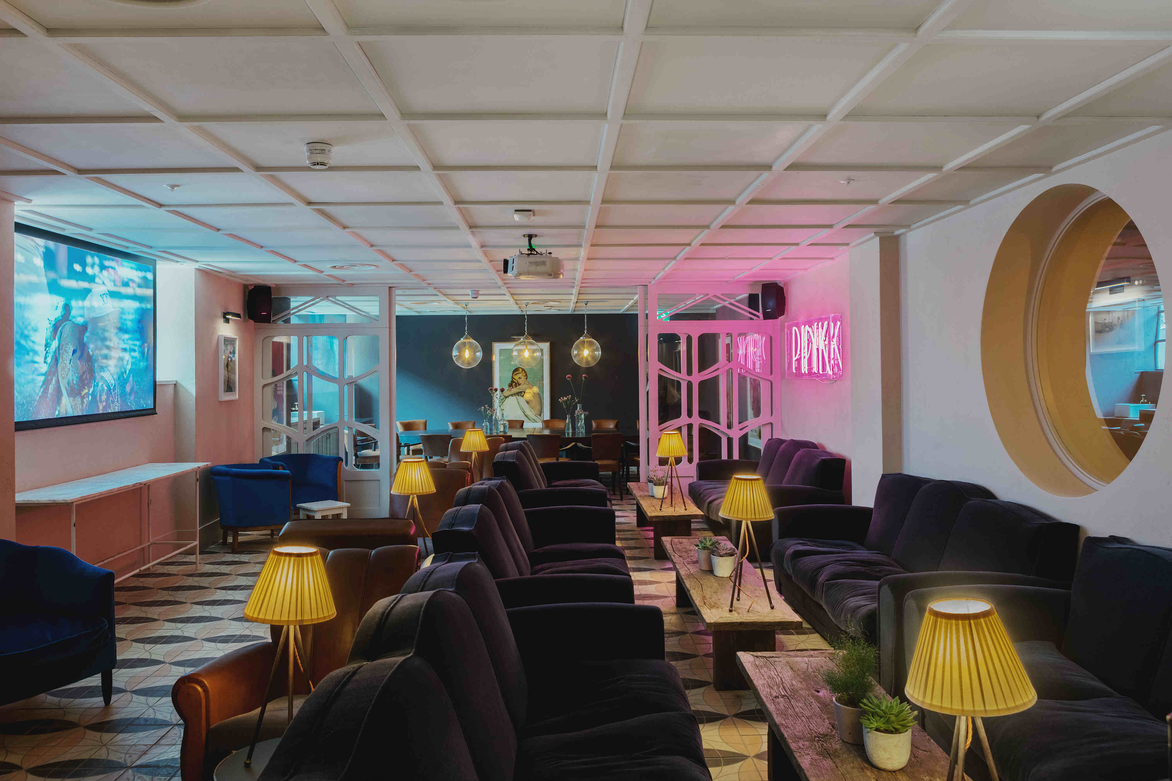 Stylish event space at The River Bar, cozy seating for intimate gatherings and presentations.