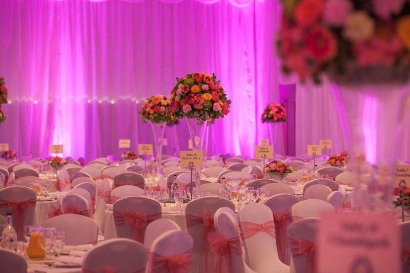 Edgbaston Stadium banqueting suite with vibrant gala lighting for wedding reception events.