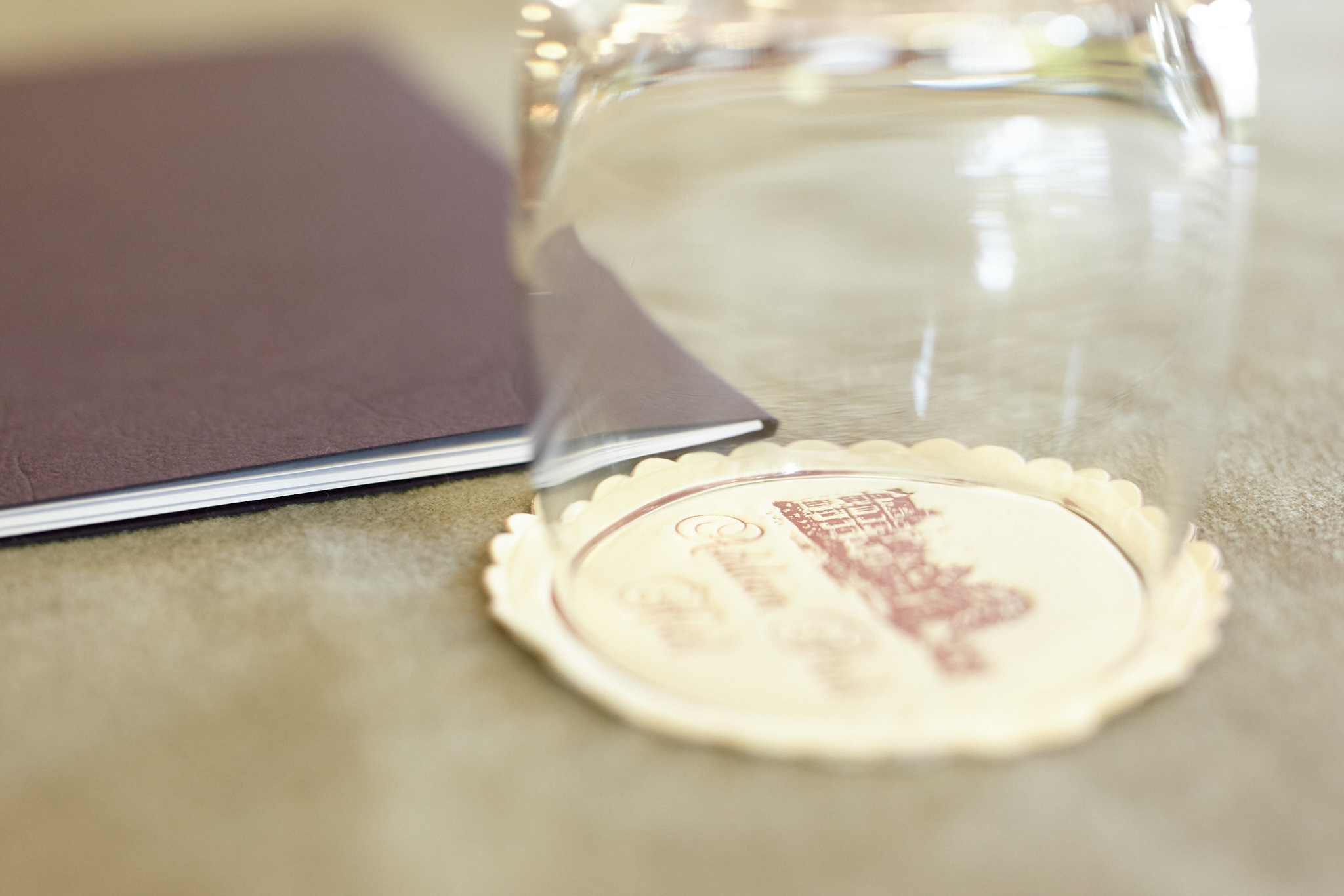 Edward Petre at Ashdown Park Hotel, elegant event setup with glass and notebook.