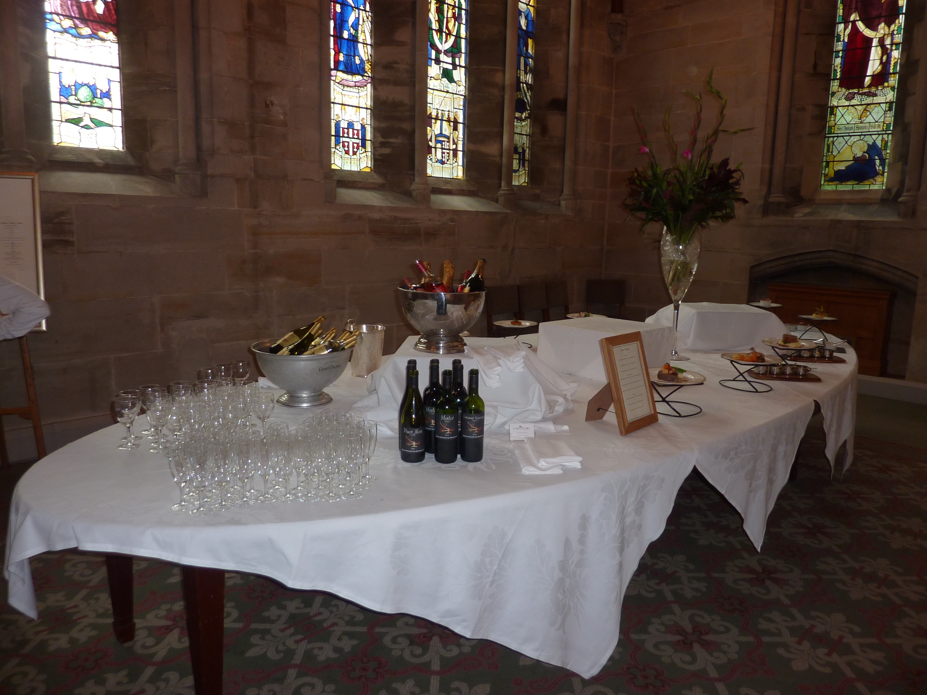 Geoffrey Webb at Ashdown Park Hotel, elegant event setup with floral arrangements and drinks.