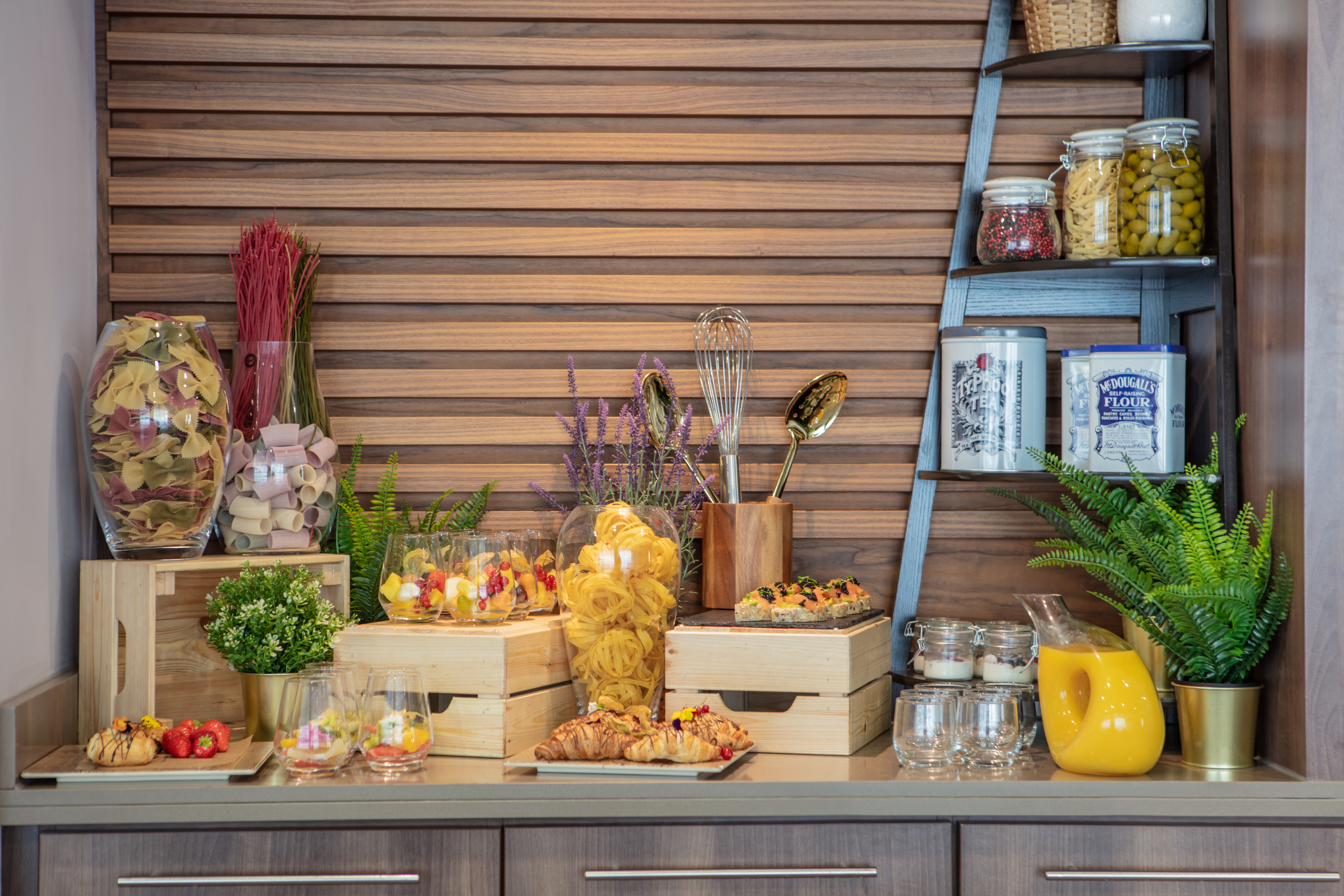 Claremont Suite refreshment station with snacks and greenery for meetings and events.