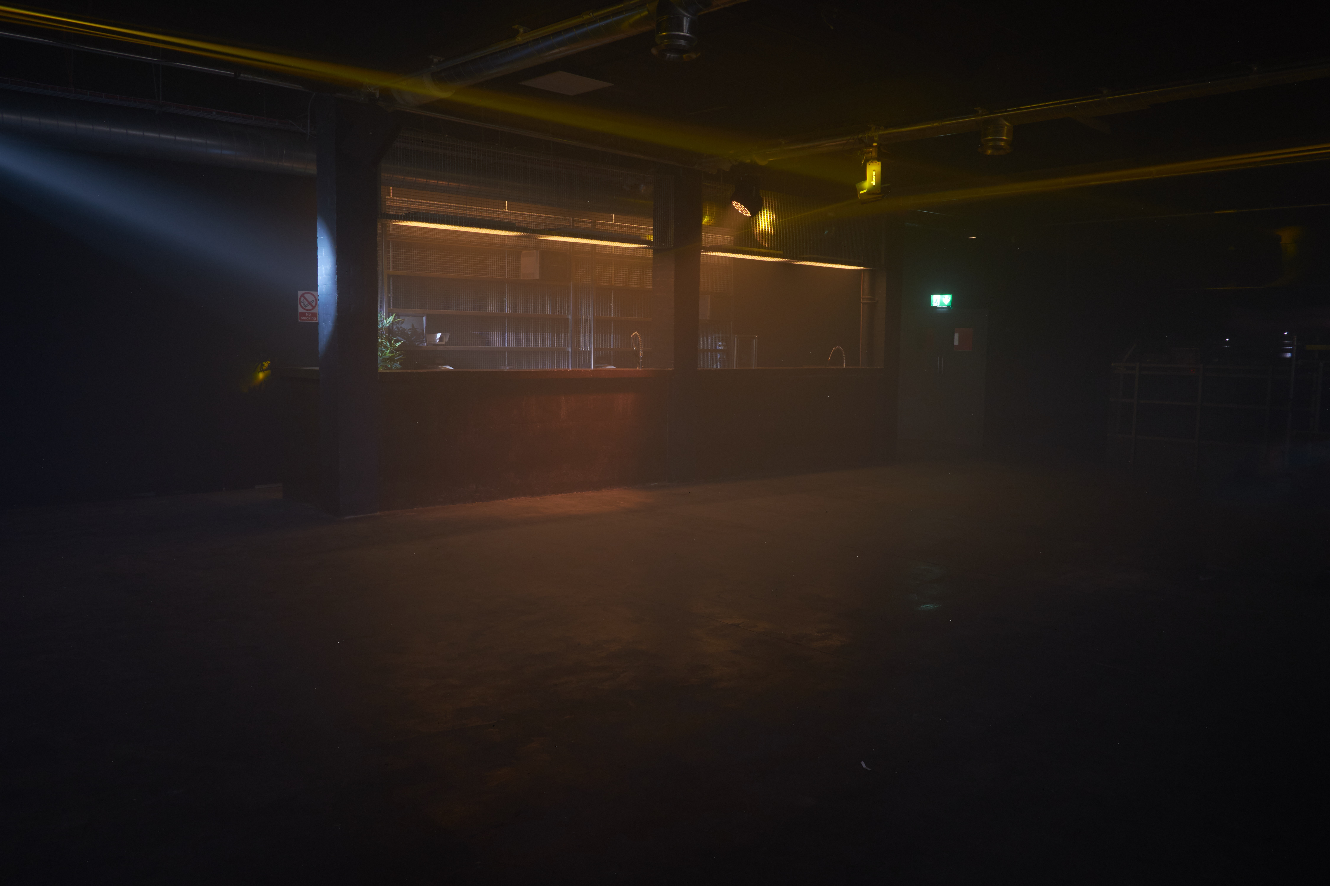 Versatile event space in FOLD with moody ambiance for corporate and social gatherings.