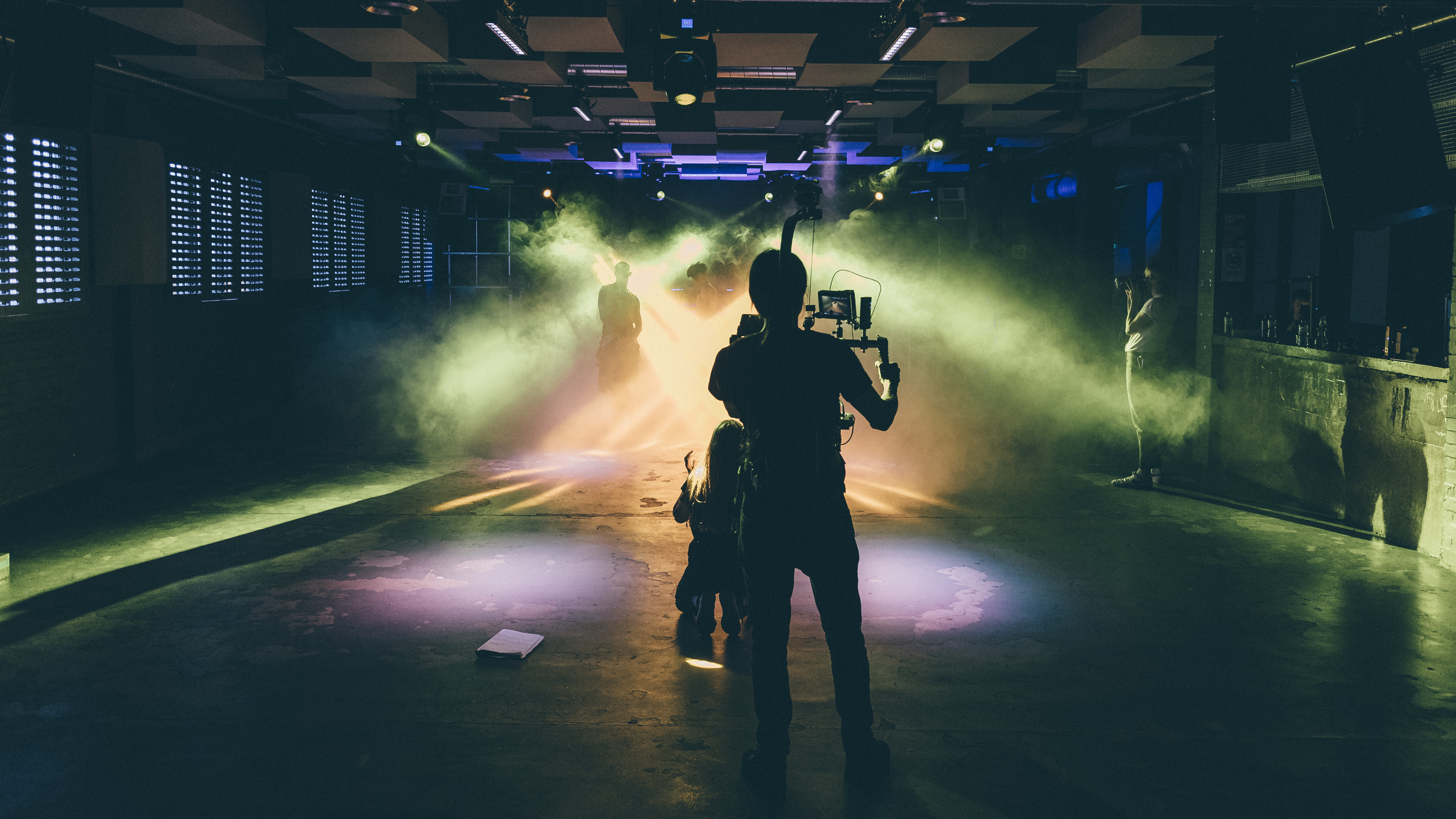 Dynamic event space in FOLD with dramatic lighting for creative gatherings.