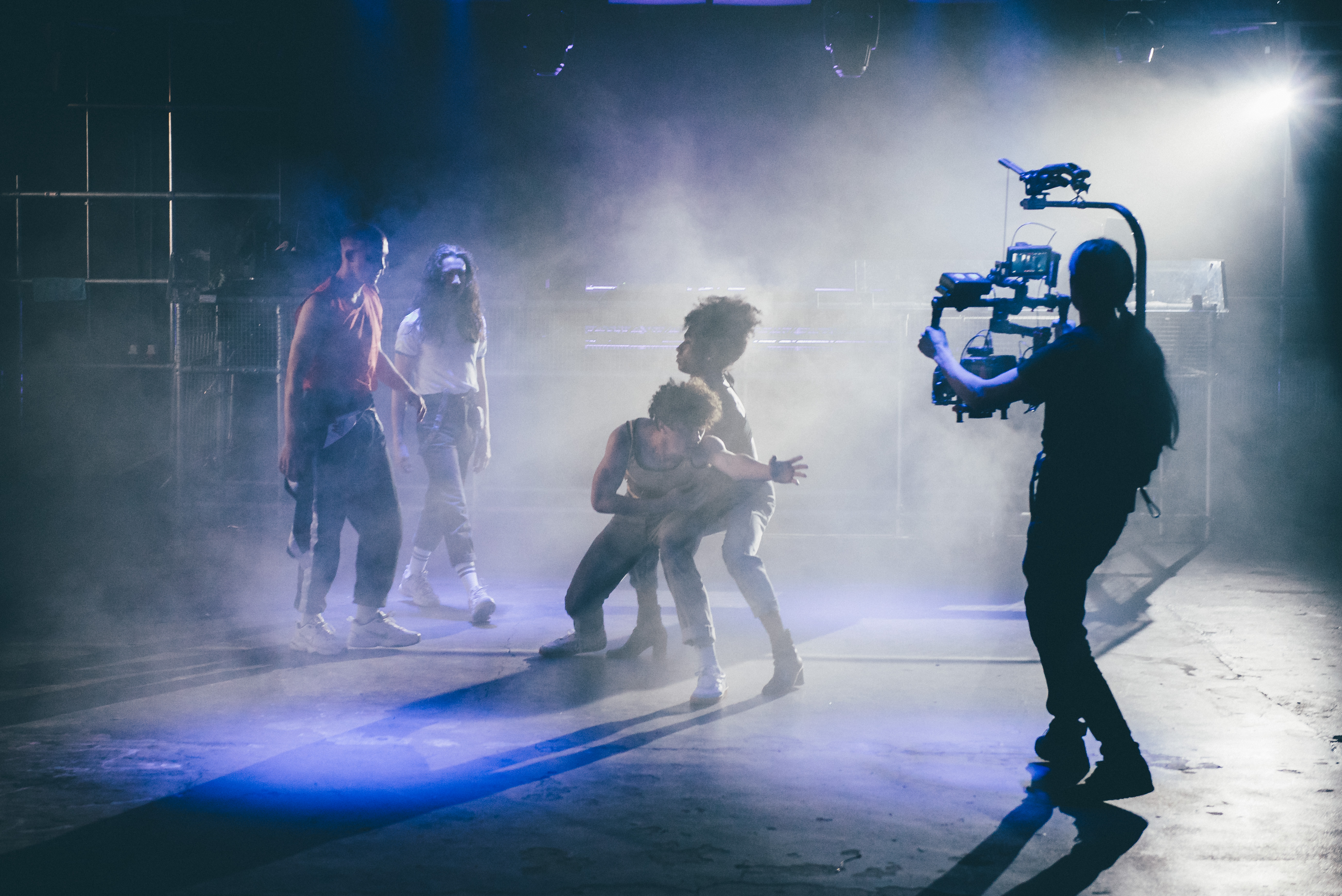 Live performance at FOLD venue with dramatic lighting and fog for immersive events.