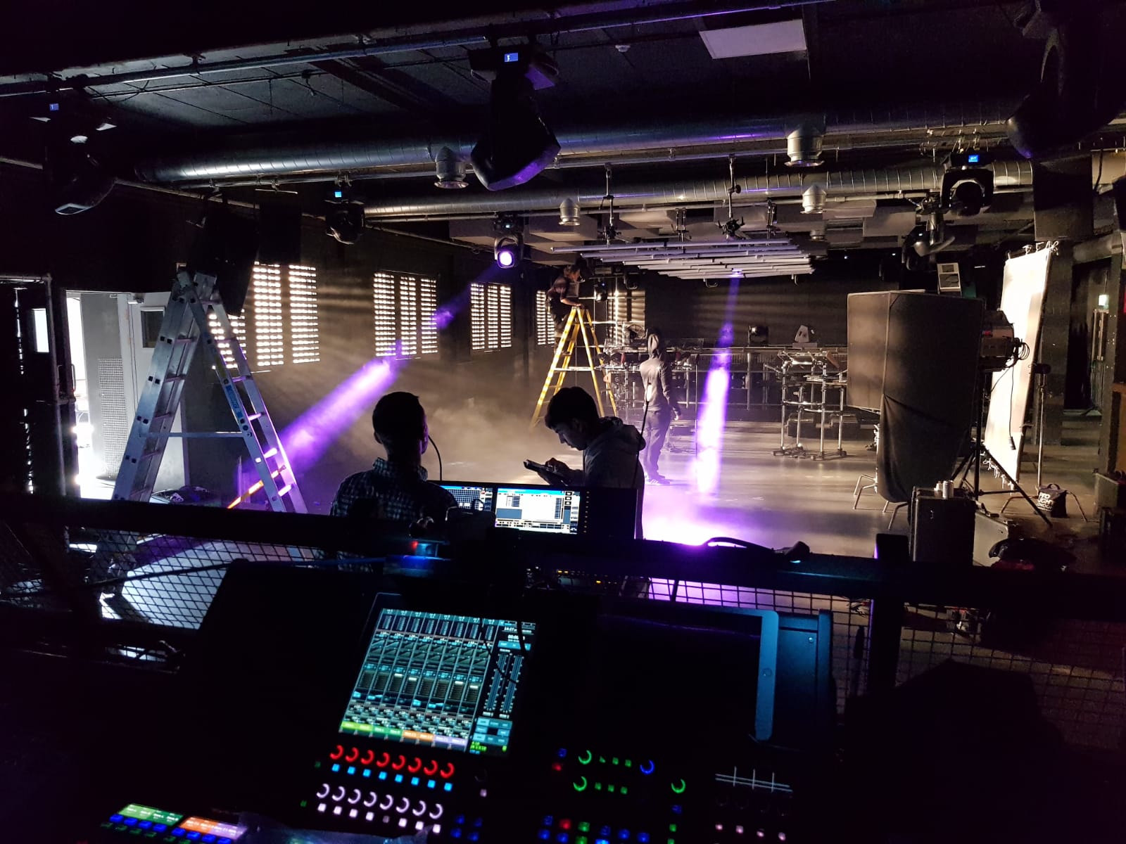 Behind-the-scenes event setup at FOLD with lighting and sound equipment.