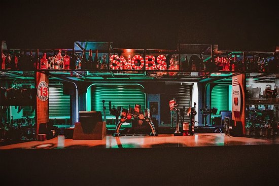 VIP Mezzanine Suite bar setup with dynamic lighting for events and gatherings.