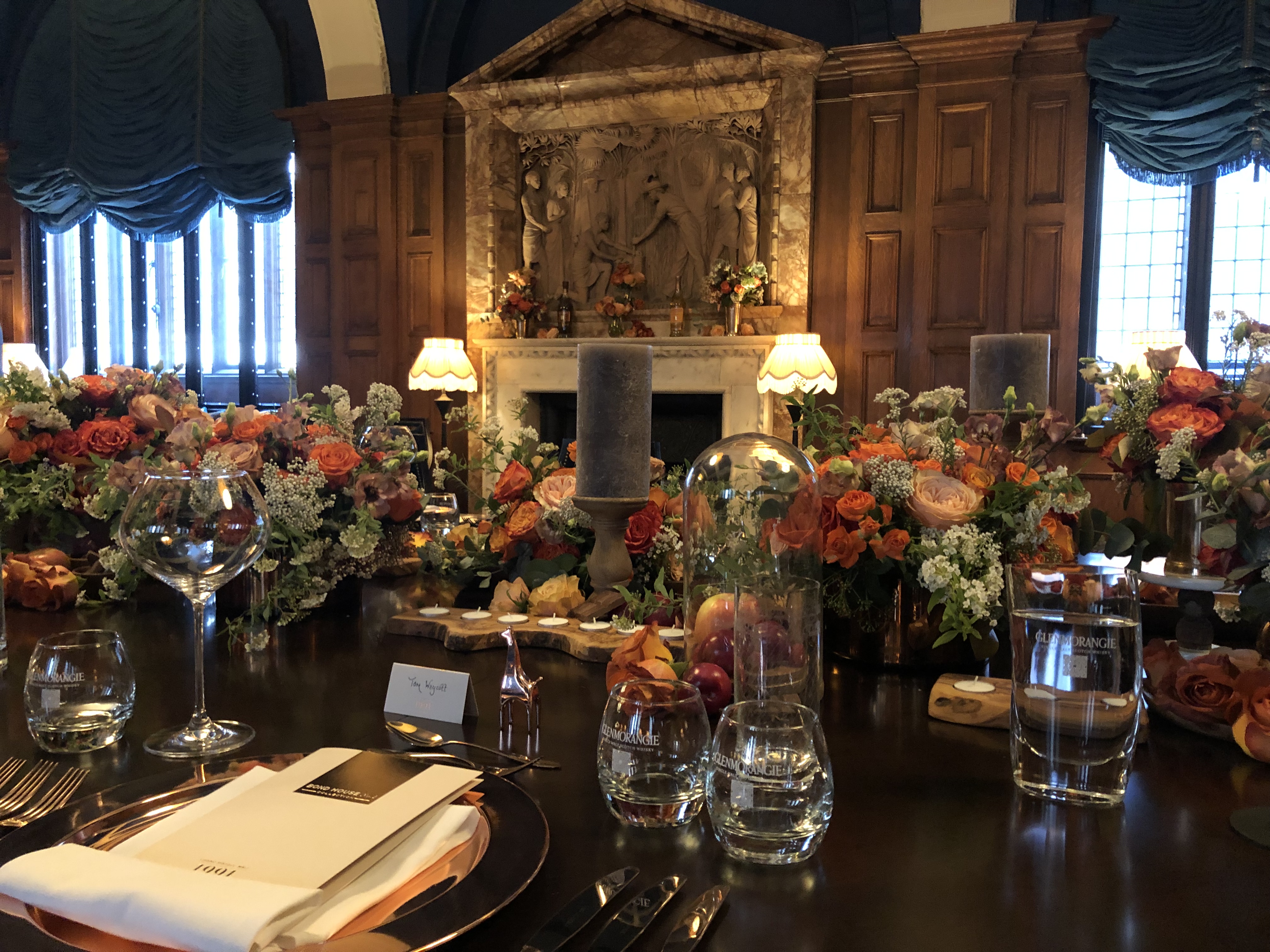 Elegant dining table with floral arrangements in L'oscar London for corporate events.