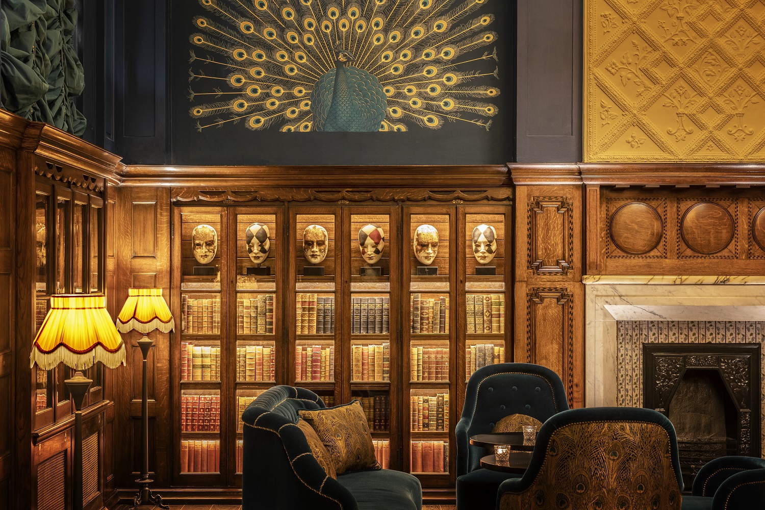 Sophisticated meeting space in L'oscar London with peacock mural, ideal for events.