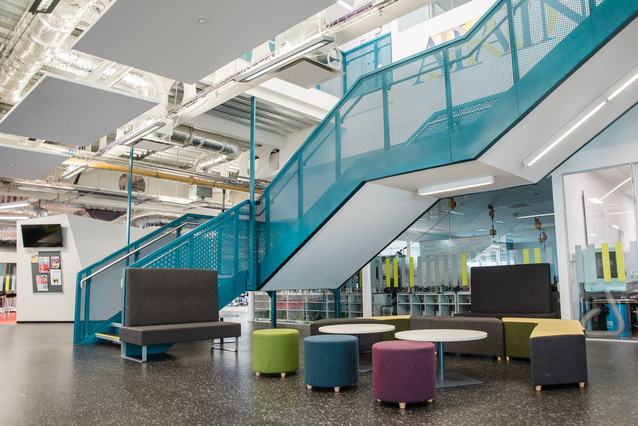 Modern breakout room with vibrant seating for networking and brainstorming events in London.