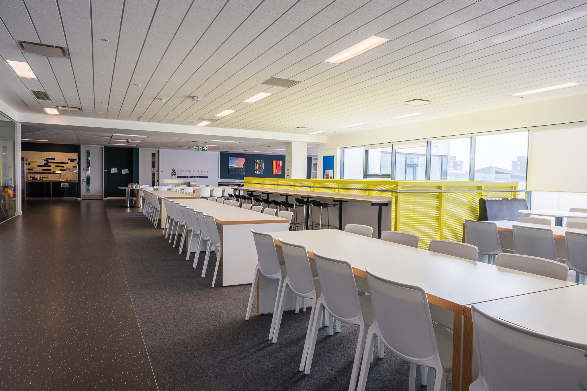 Spacious dining area in London Academy of Excellence for events and meetings.