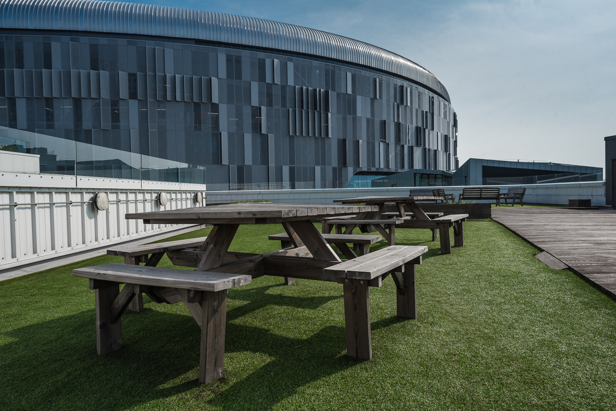 Rooftop terrace with picnic tables at London Academy of Excellence for events and gatherings.
