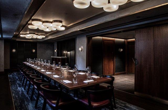 Sophisticated private dining room with elegant table for corporate events and meetings.