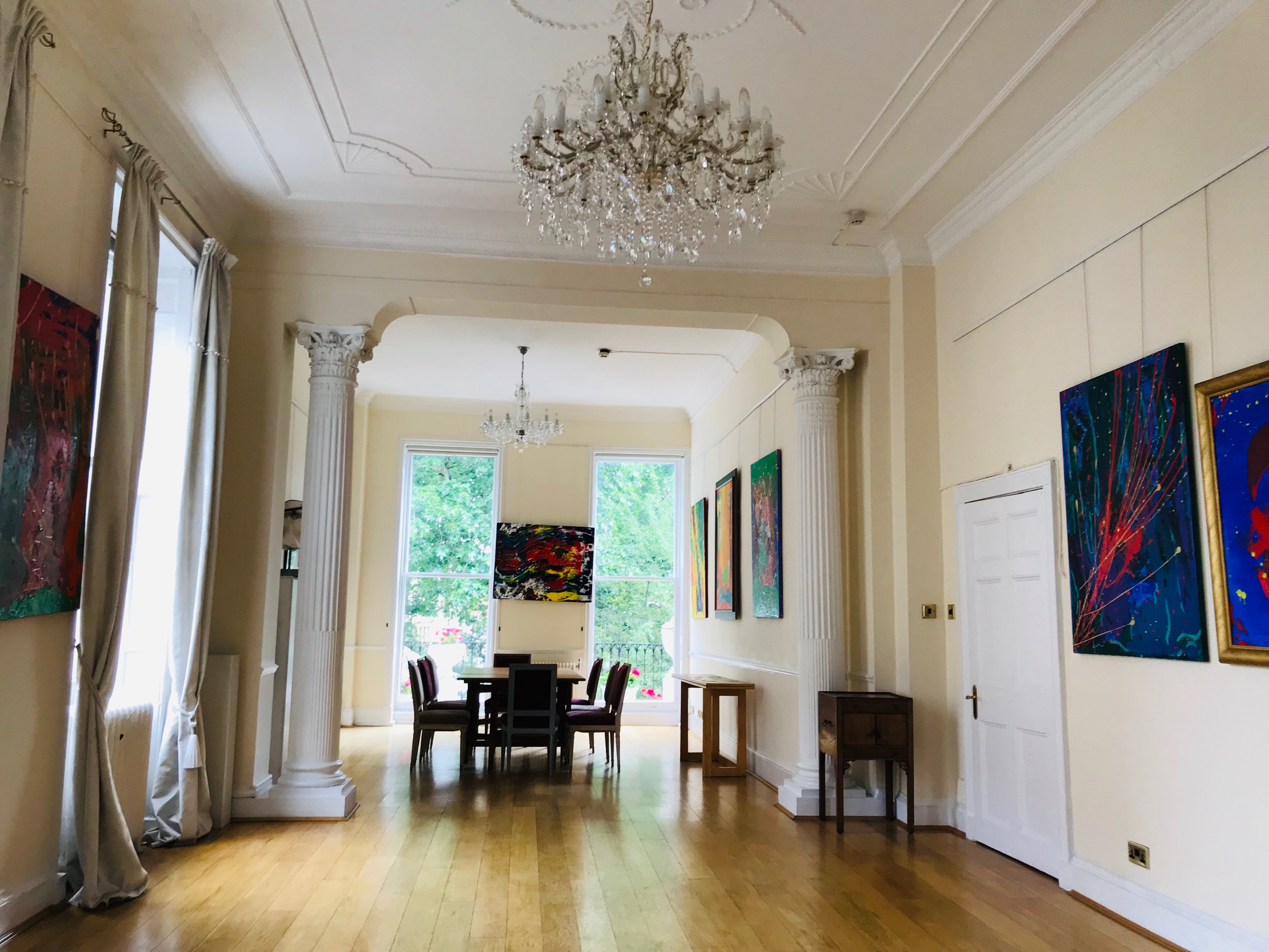 Grand Hall at Ratiu Family Foundation, elegant meeting room with high ceilings and chandelier.