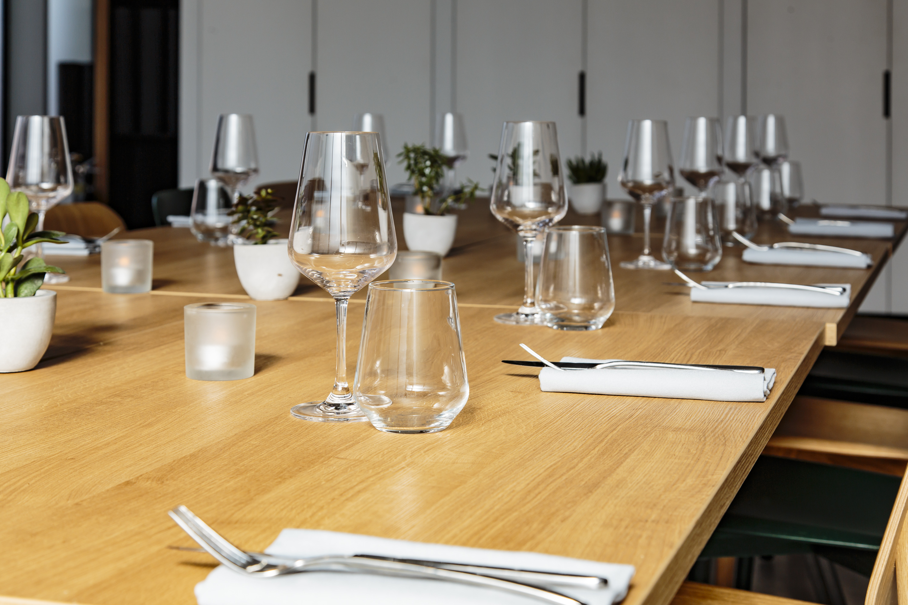 Minimalist dining table setup in FoodWell studio for corporate meetings and events.