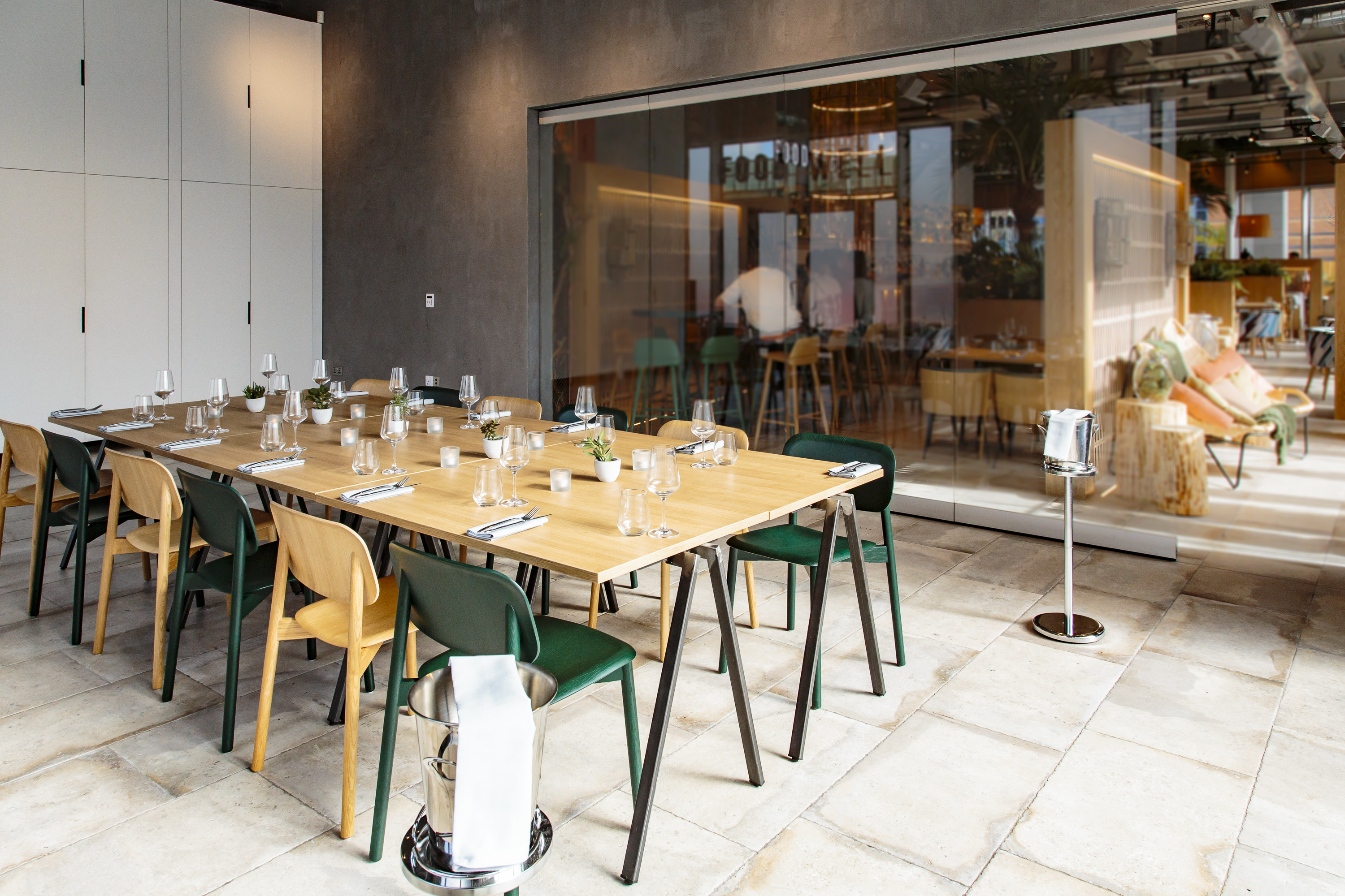 Modern meeting space with glass walls, ideal for corporate events and gatherings.