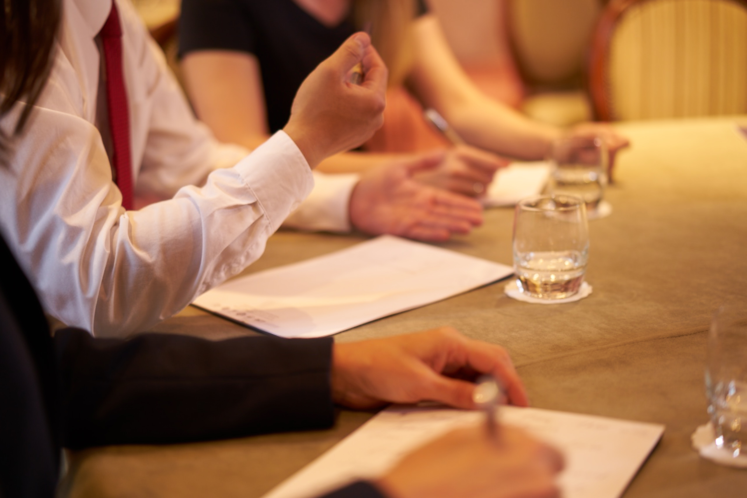 Josiah Ranger leads a collaborative meeting at Ashdown Park Hotel, fostering teamwork.