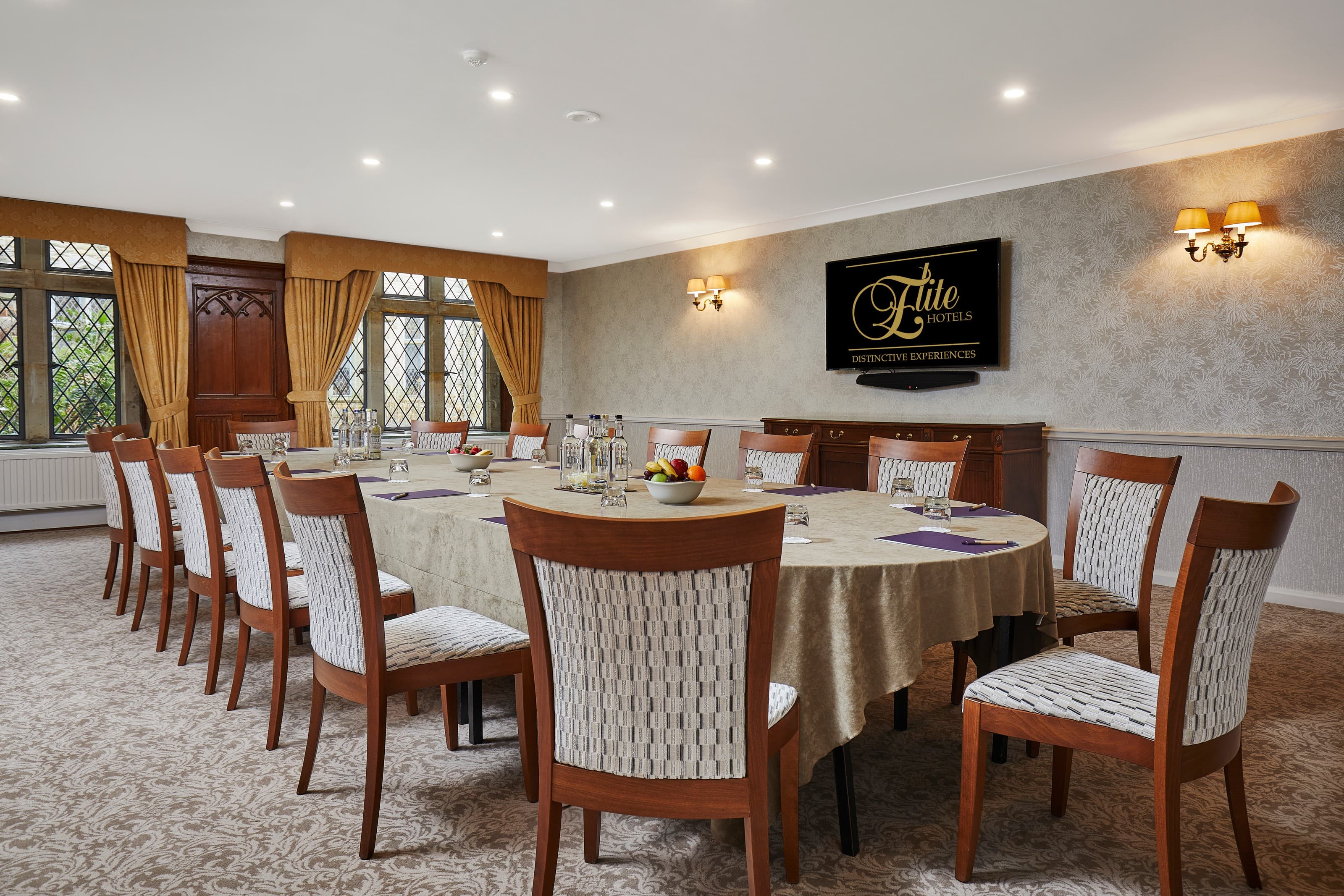 Laura Stafford in a formal boardroom at Ashdown Park Hotel for executive meetings and dining.