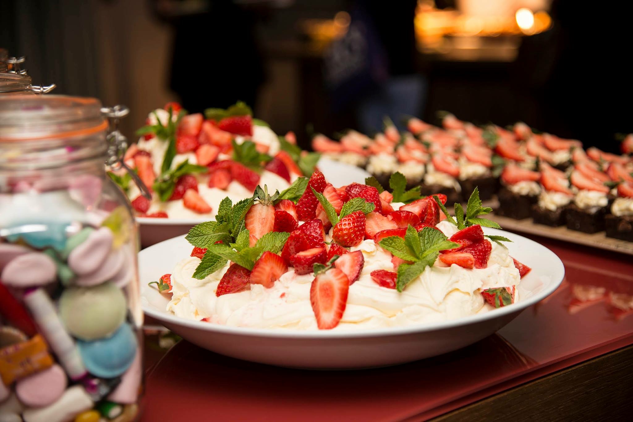 Dessert display at Marco Pierre White Steakhouse with pavlova and cupcakes for events.
