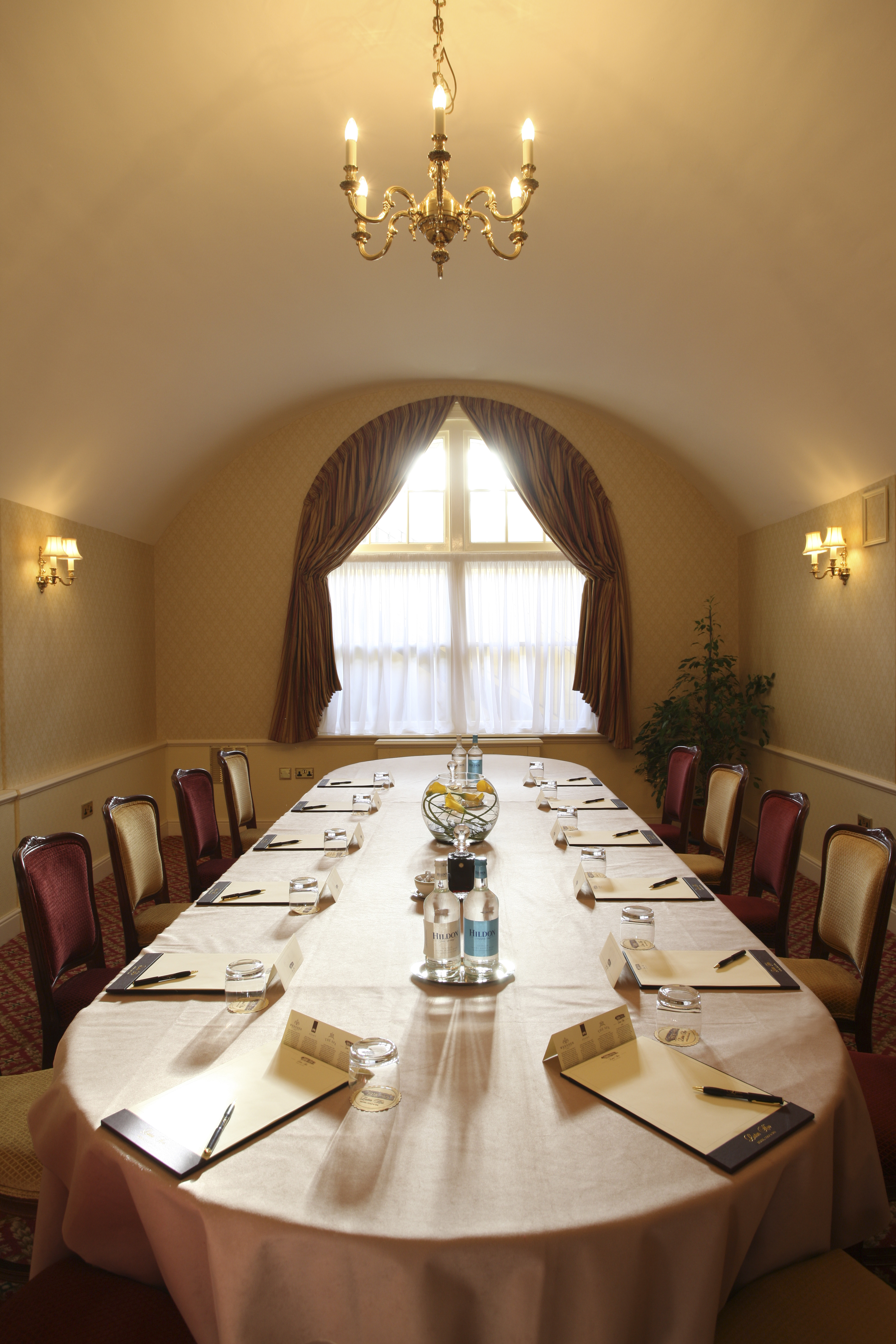 Charles Mewes in a bright, elegant meeting room at Luton Hoo Hotel for professional events.