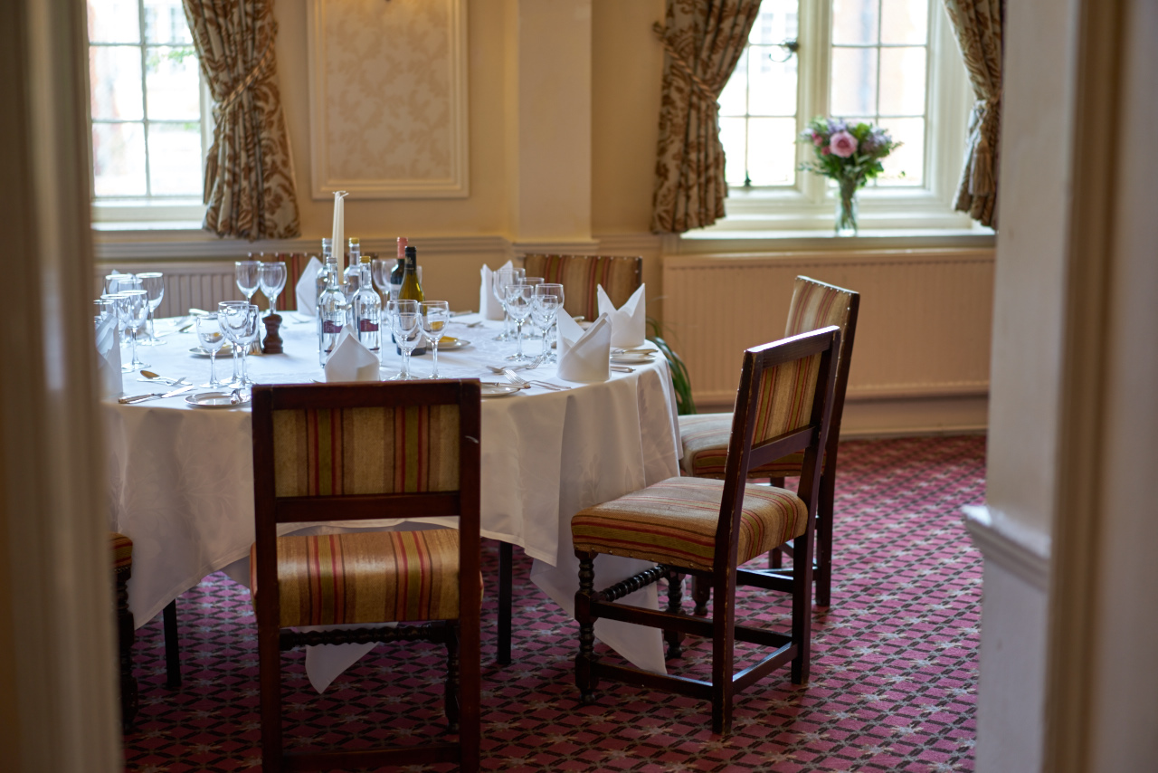 Elegant dining table at Tylney Hall, ideal for intimate events and meetings.