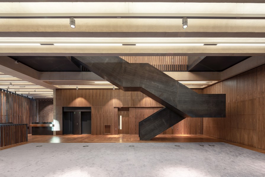 Modern Elizabeth Room venue with striking staircase, ideal for corporate events and meetings.