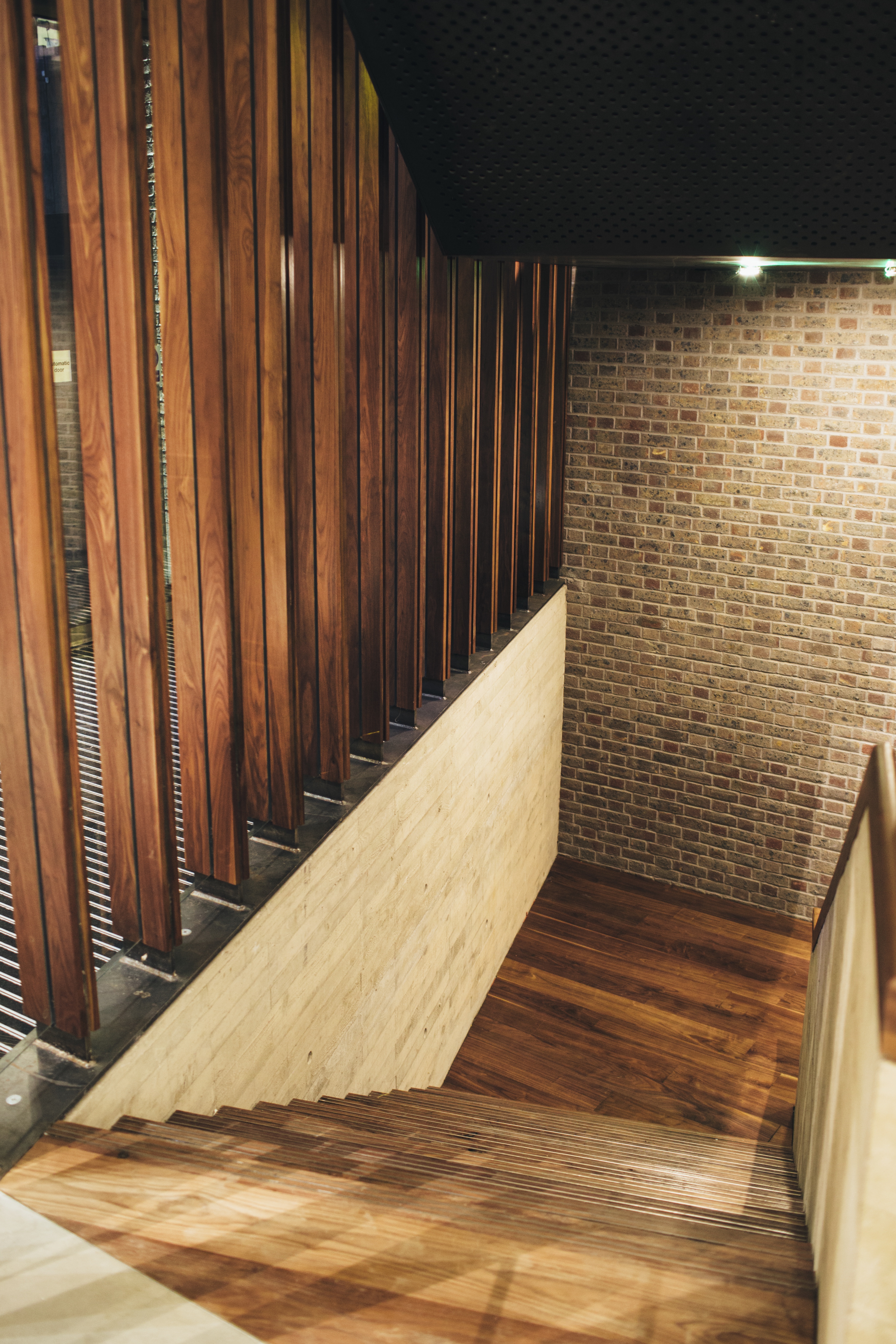 Modern Elizabeth Room with wood and brick, perfect for networking events and meetings.