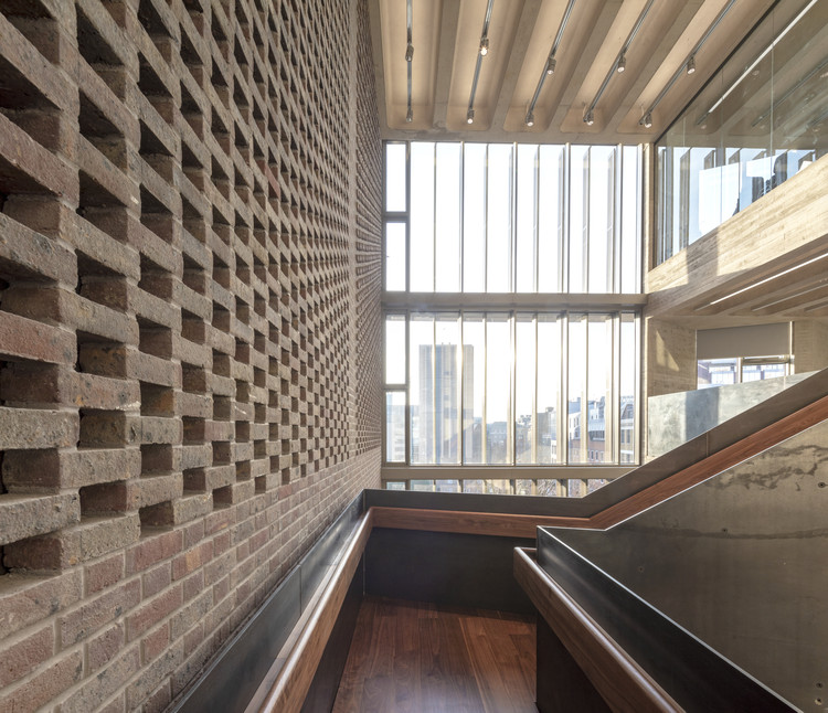 Modern Elizabeth Room with brick and glass, perfect for networking events and meetings.