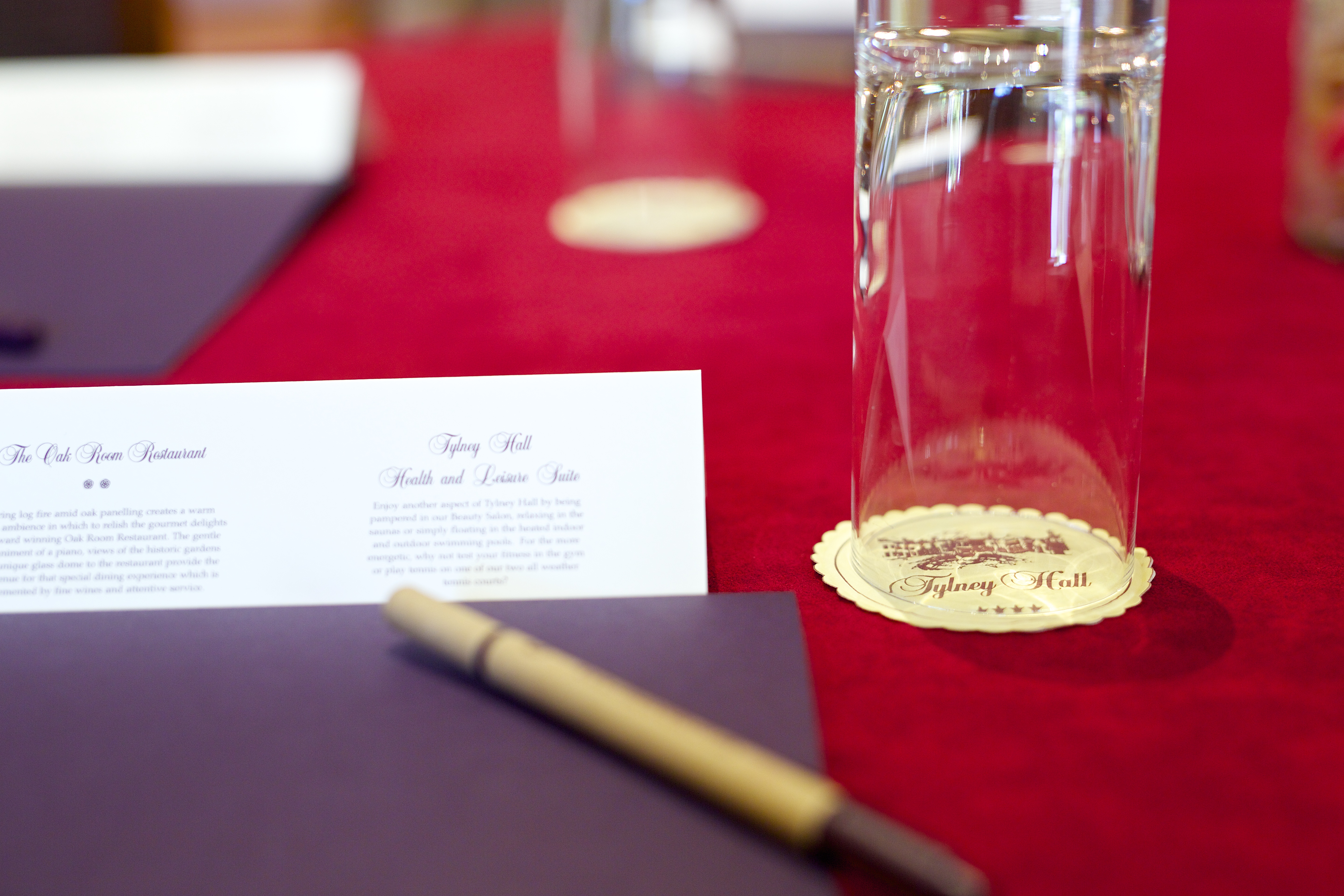 Tylney Suite meeting setup with polished table and elegant stationery at Tylney Hall Hotel.