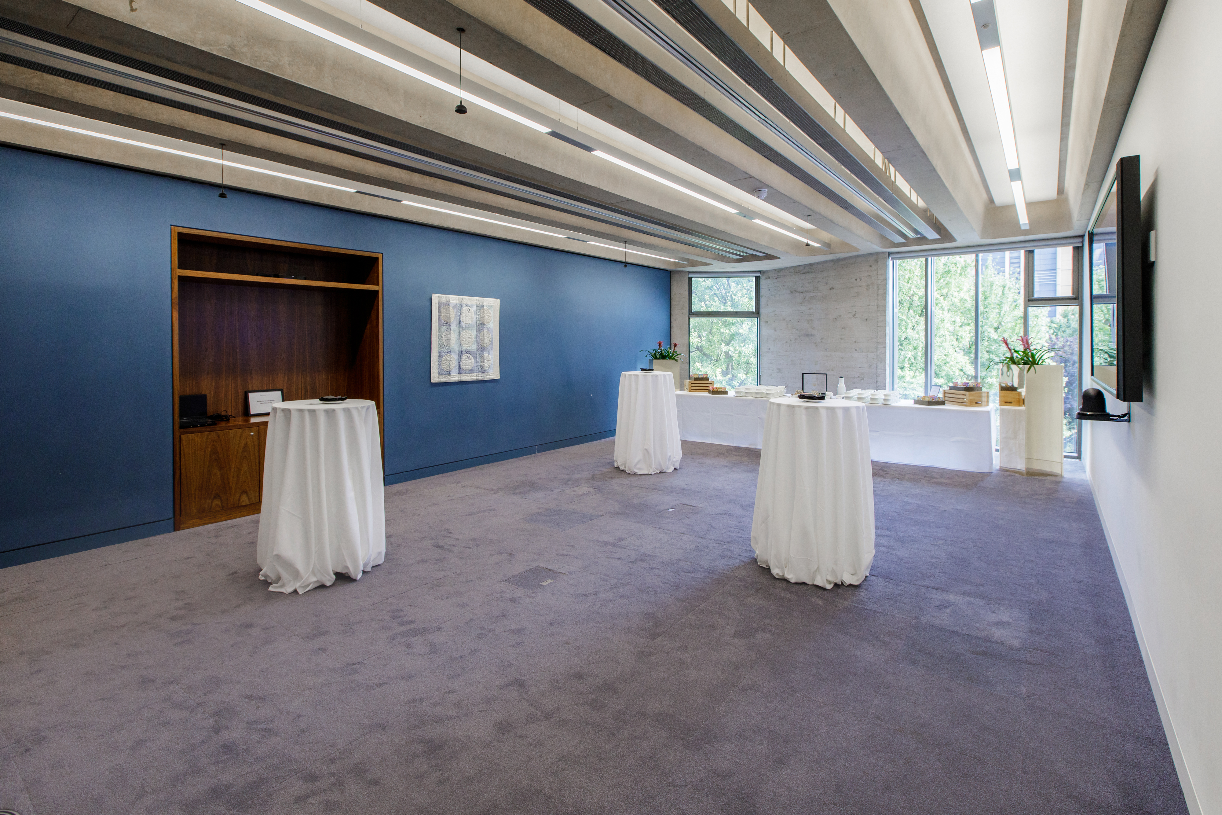 Modern event space with high ceilings, ideal for networking and gatherings.