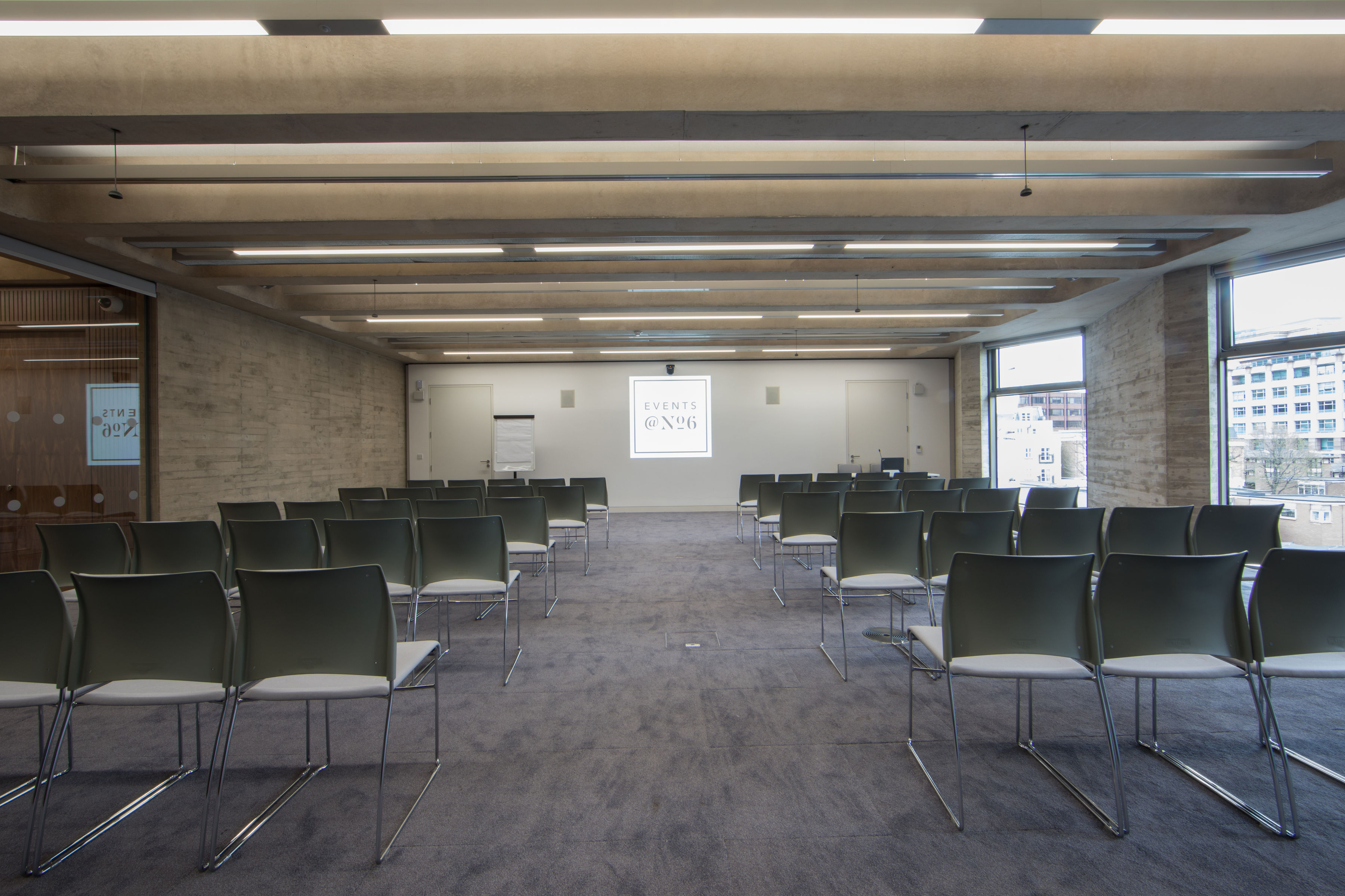 Carlton Room meeting space with sleek chairs, ideal for presentations and workshops.