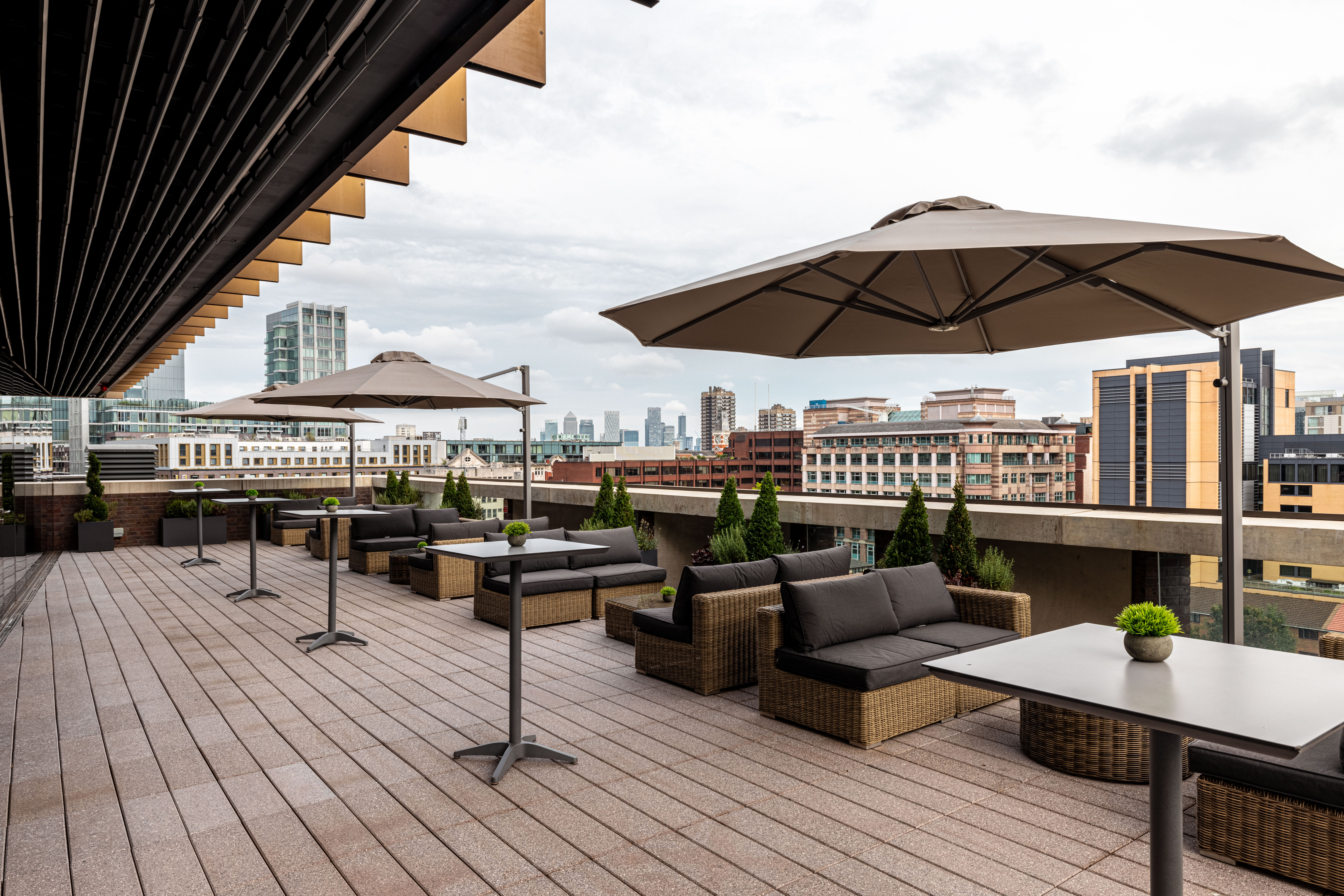 Stylish rooftop venue with panoramic city view for networking events and gatherings.