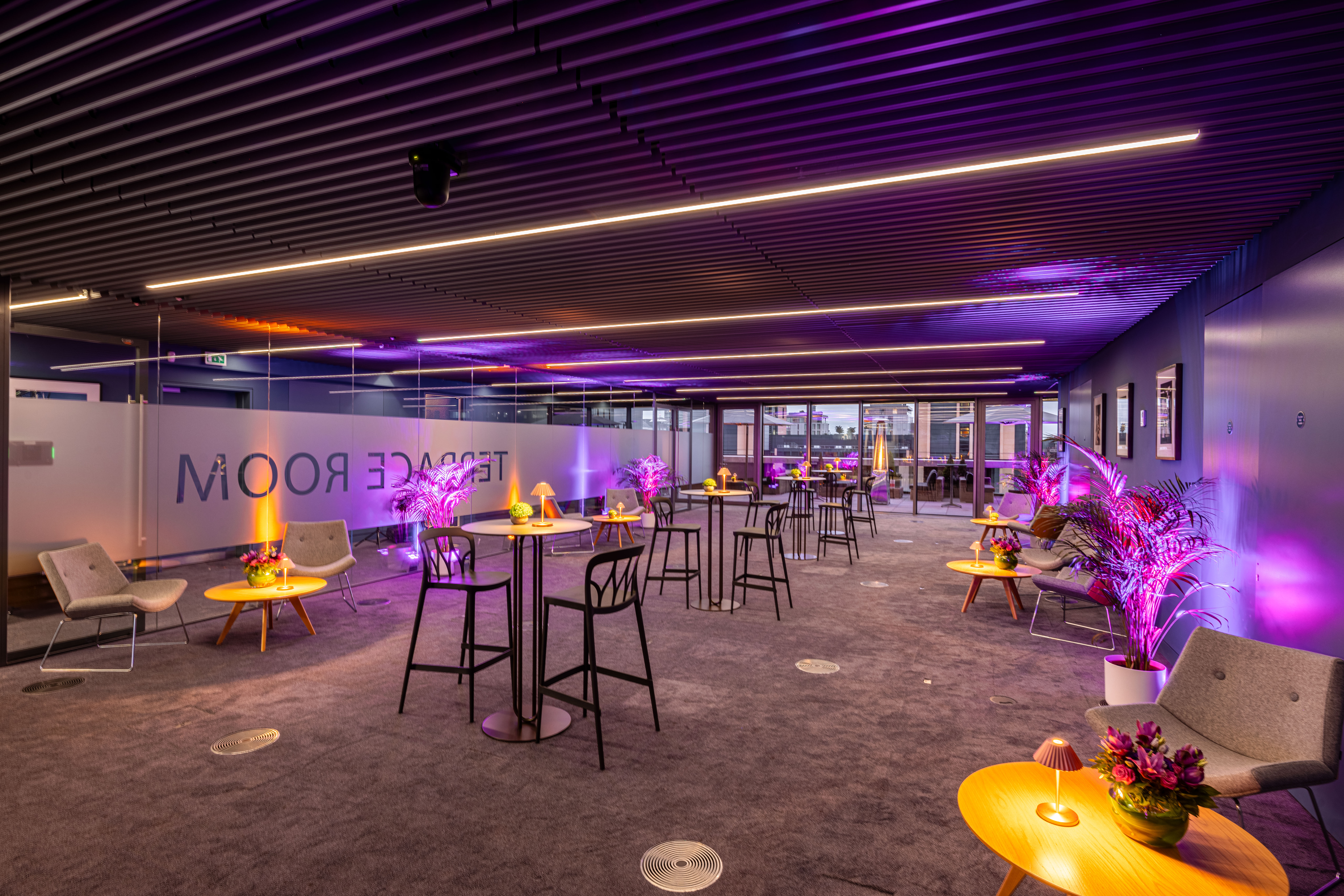 Modern Terrace Room event space with vibrant lighting for meetings and gatherings.