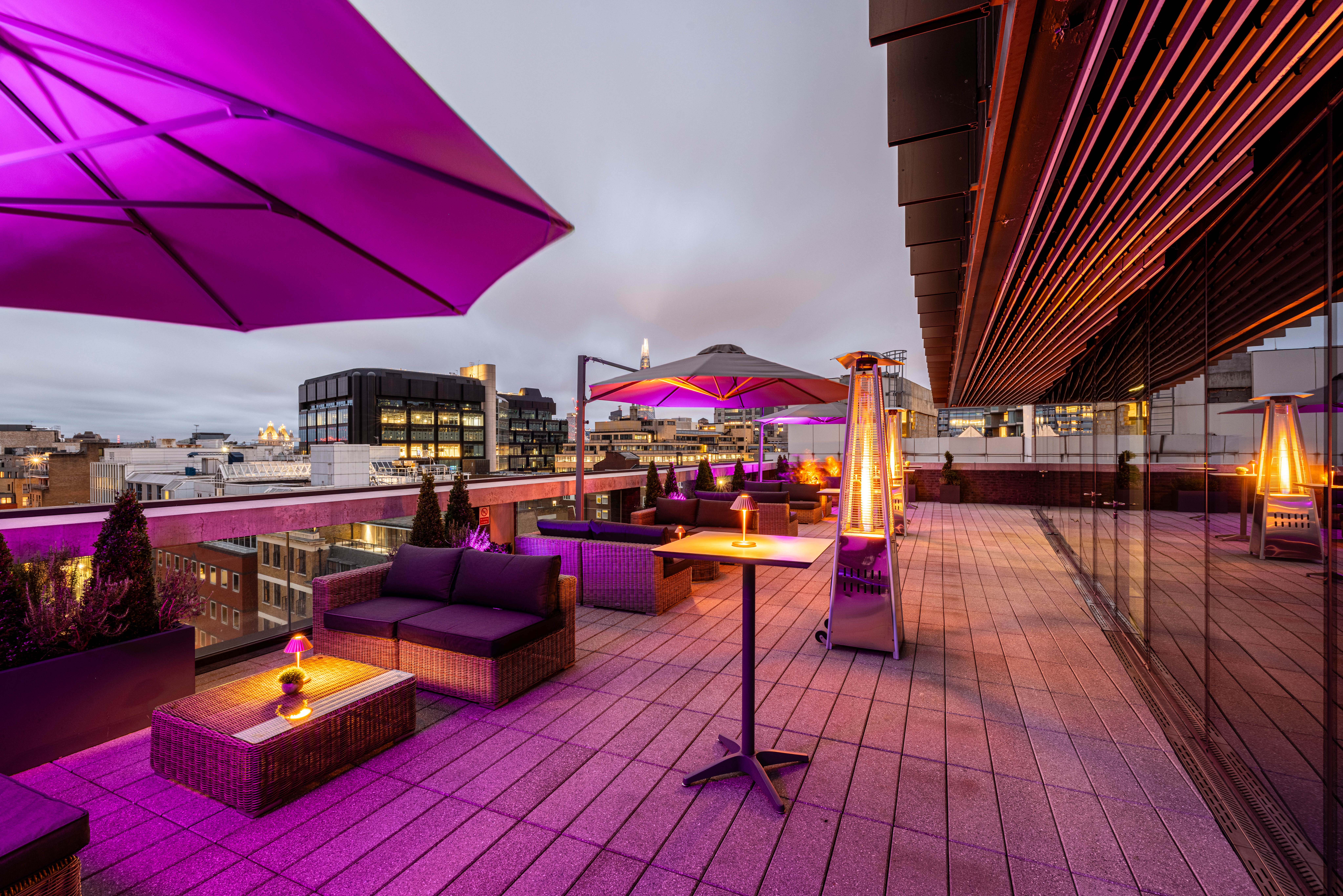 Stylish rooftop venue with modern seating for upscale events and gatherings.
