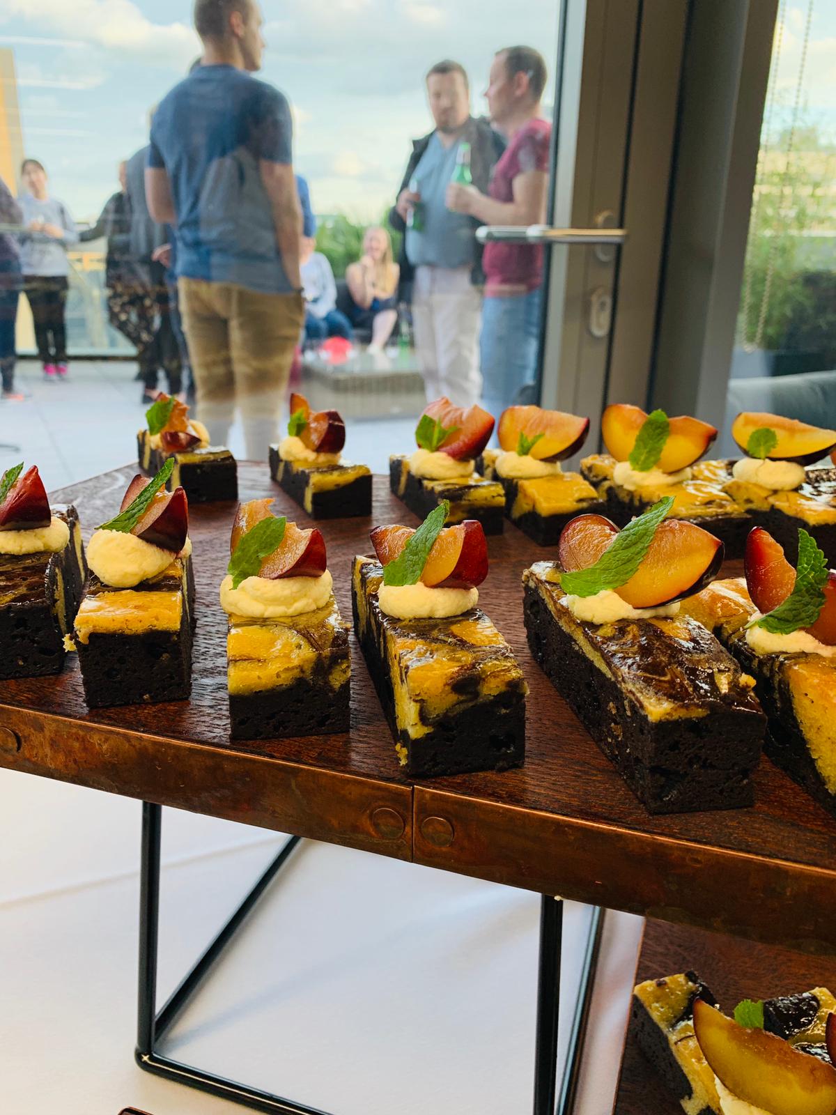 Vibrant networking event in Terrace Room with gourmet hors d'oeuvres and outdoor setting.