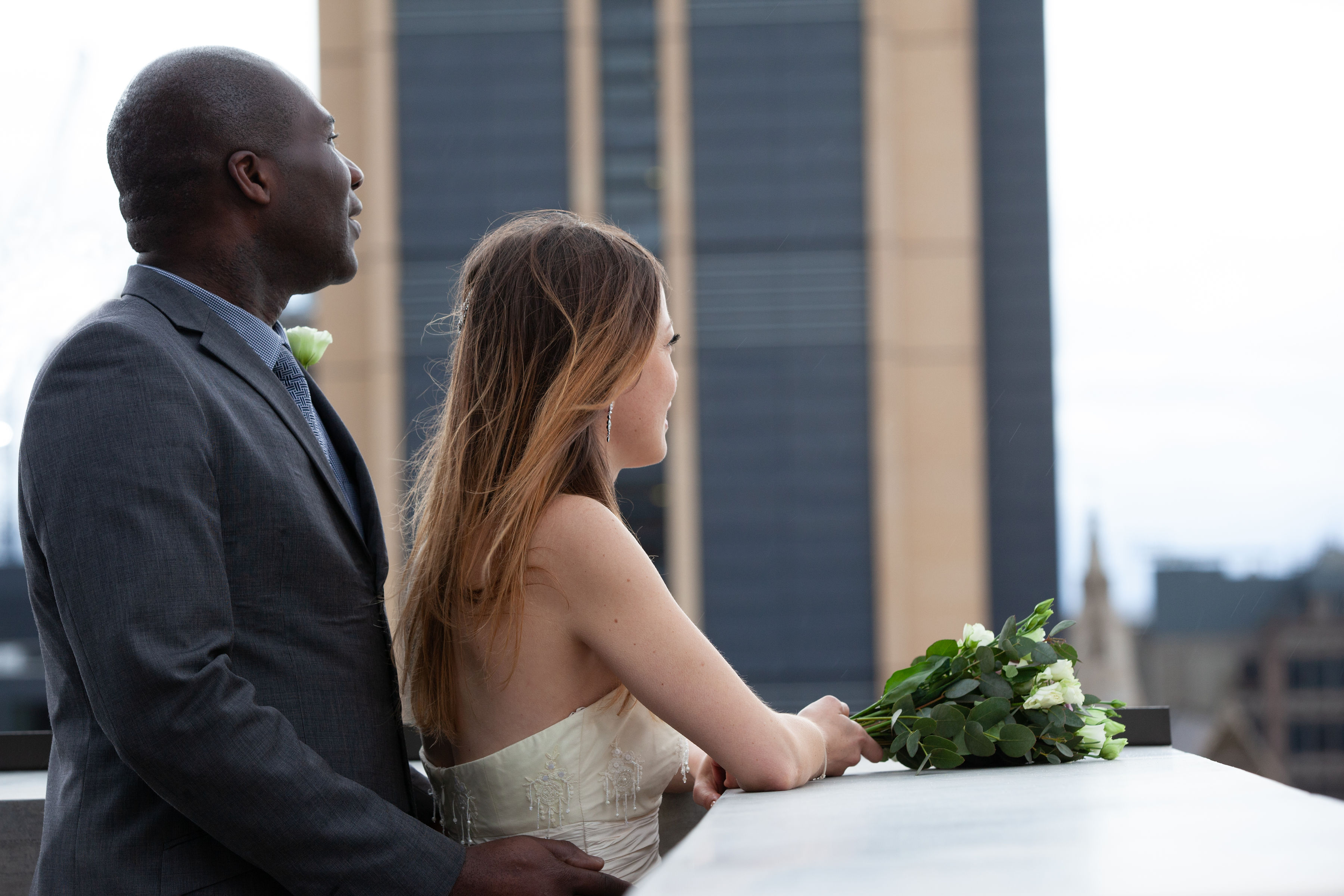 Couple enjoying a rooftop wedding in the elegant Terrace Room with urban skyline backdrop.