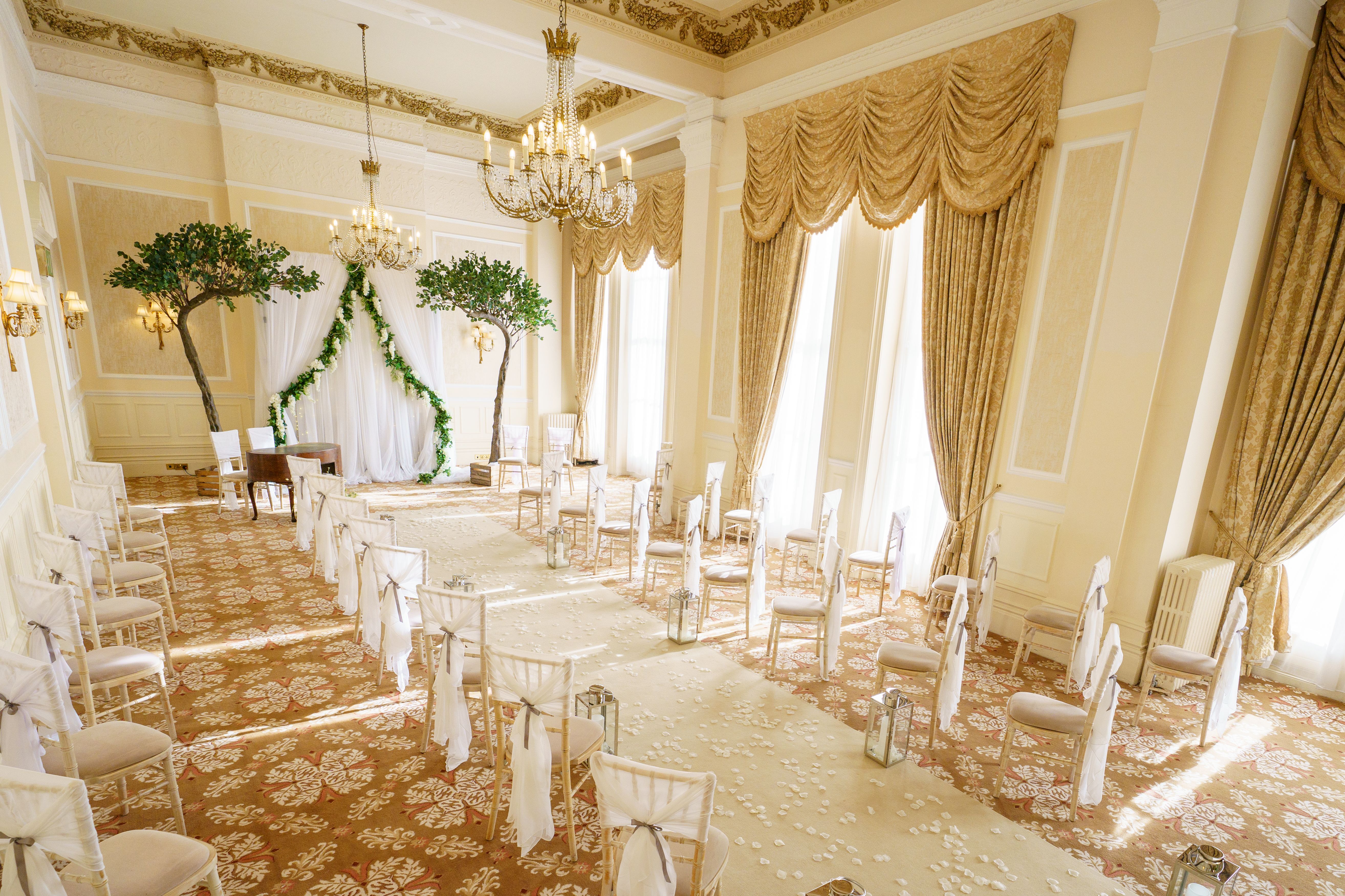 Elegant wedding venue with lush greenery and soft lighting at The Grand Hotel, Eastbourne.