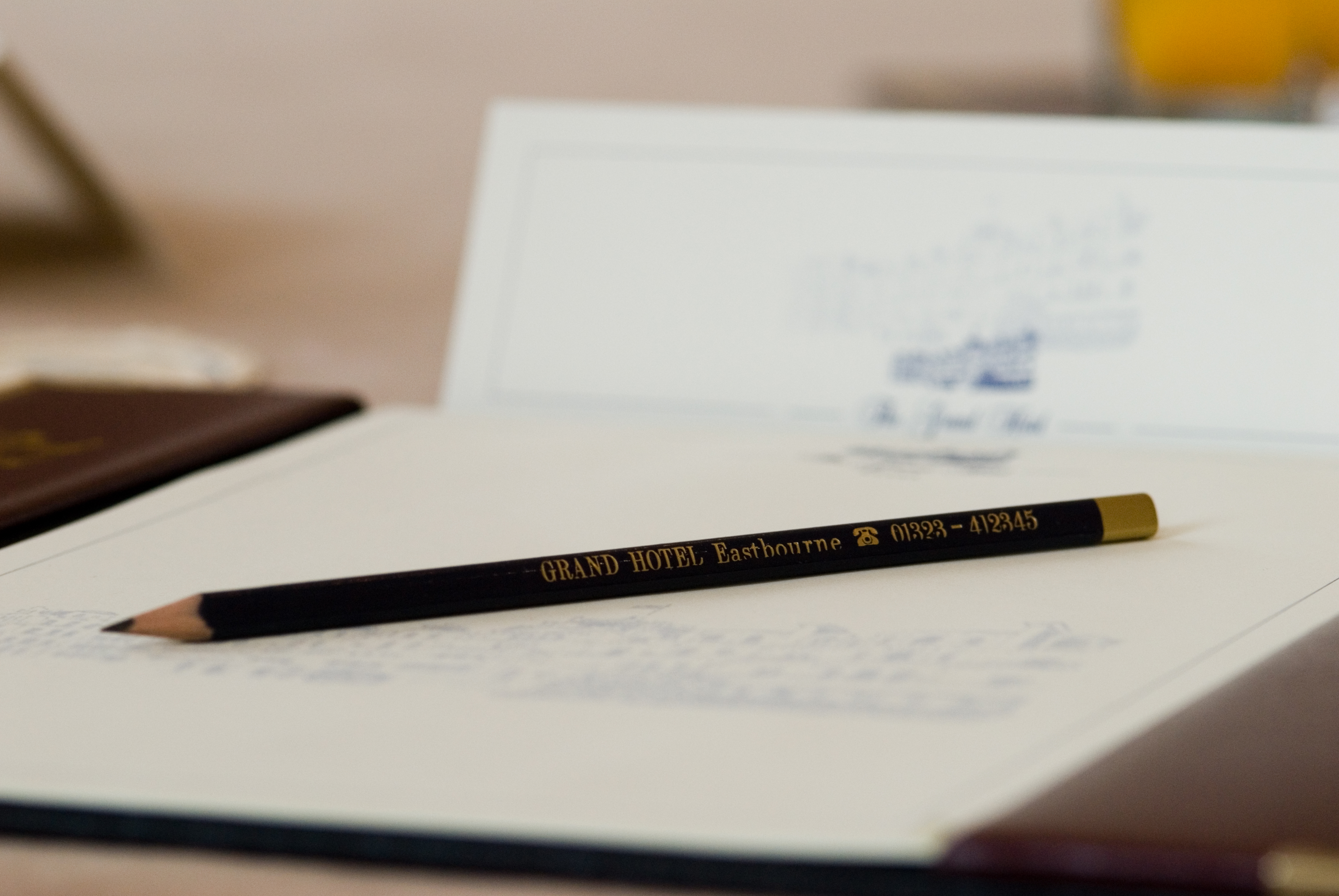 Norfolk Room meeting setup with branded pencil and notepad at Grand Hotel, Eastbourne.