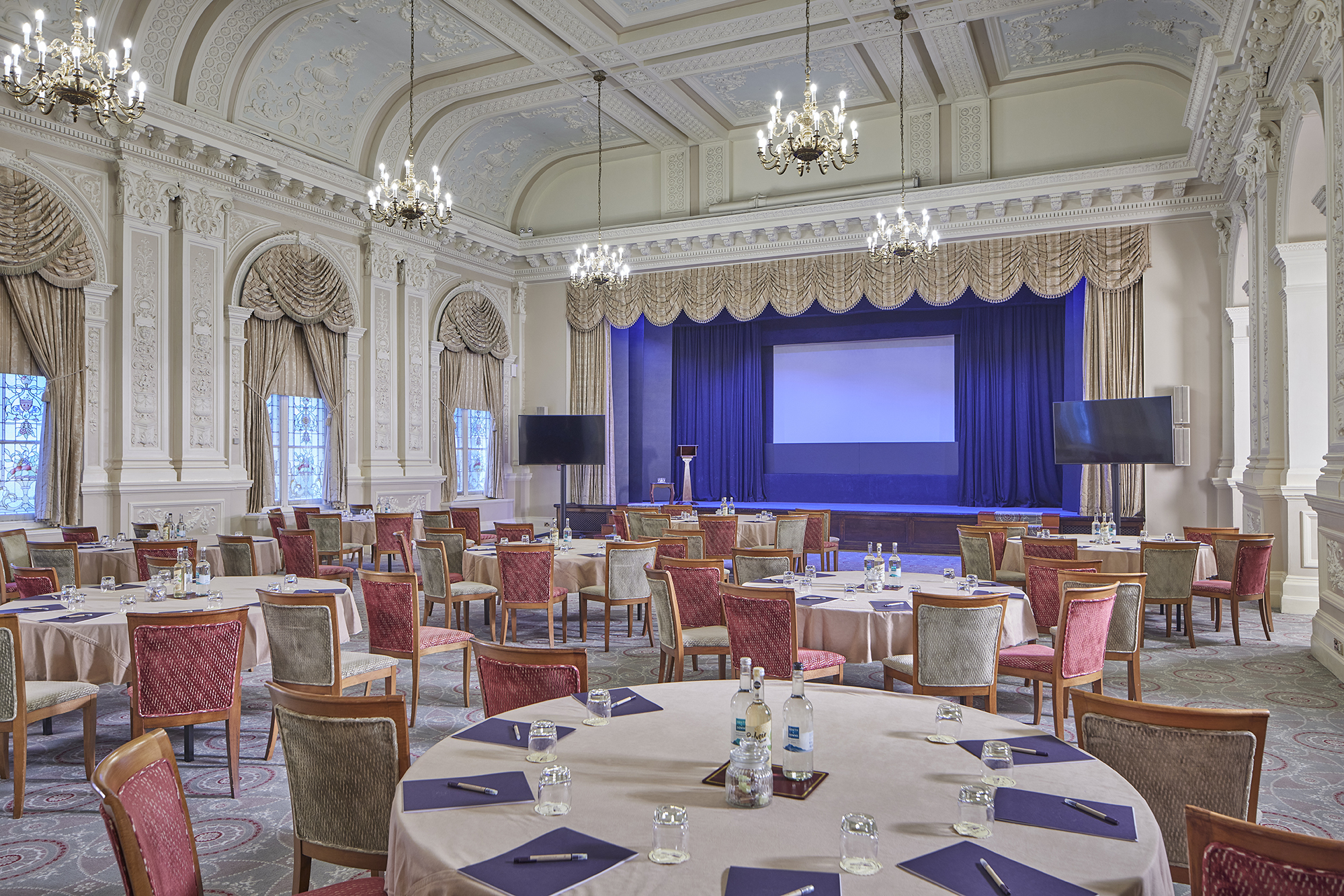 The Compton Room at The Grand Hotel, Eastbourne: elegant conference space with round tables.