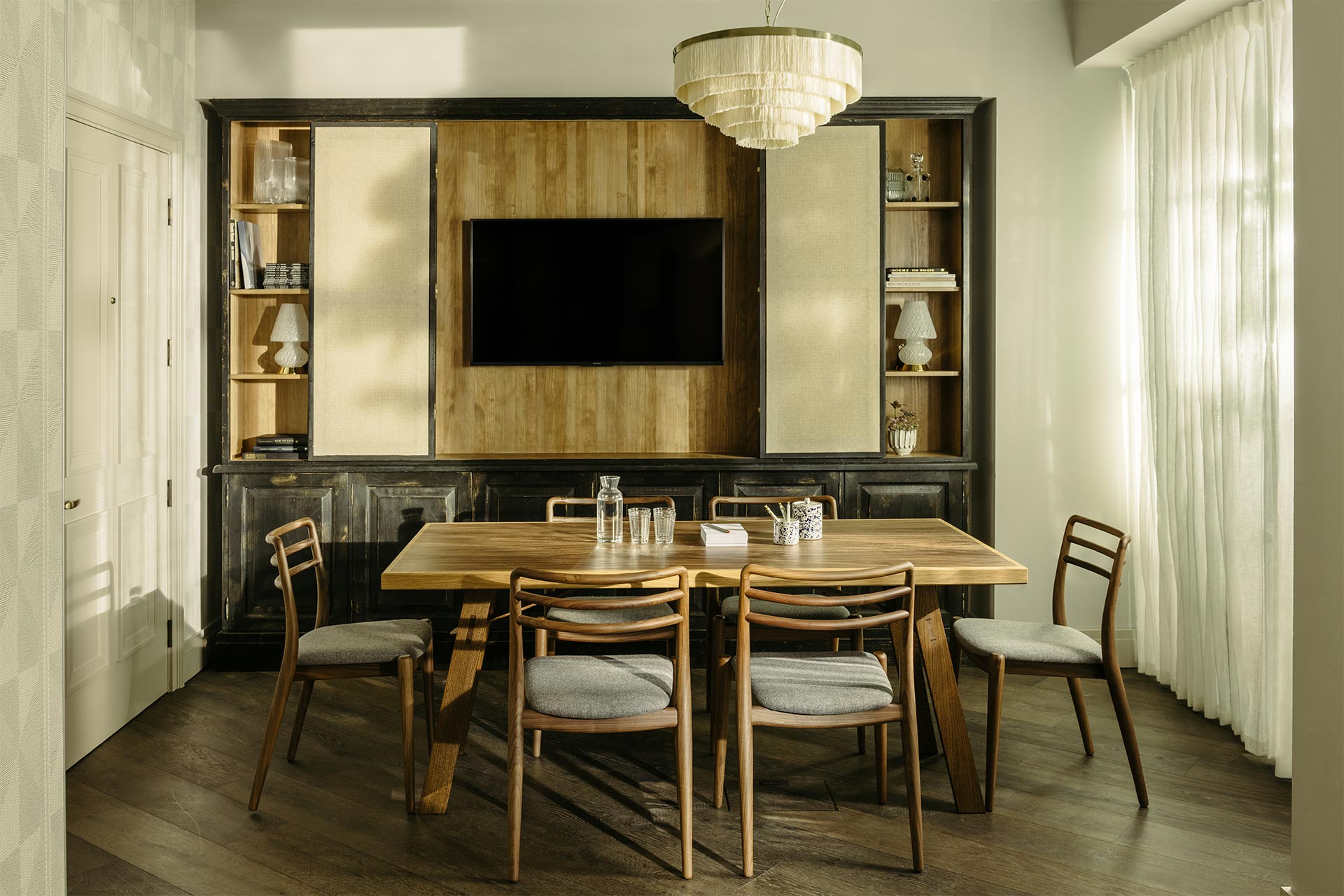 Stylish meeting room at The Hoxton Southwark with modern wooden table for gatherings.