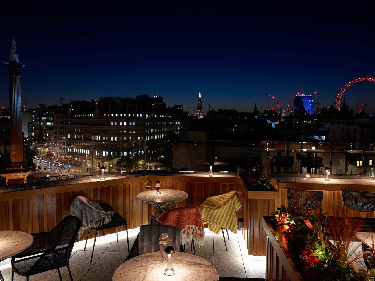 Rooftop venue at Trafalgar St James with city skyline, ideal for evening events and gatherings.